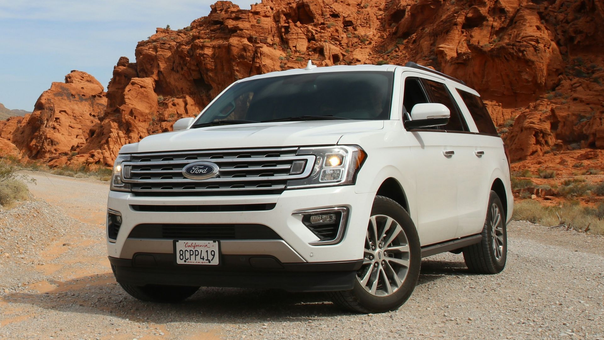 parked white Ford Explorer SUV