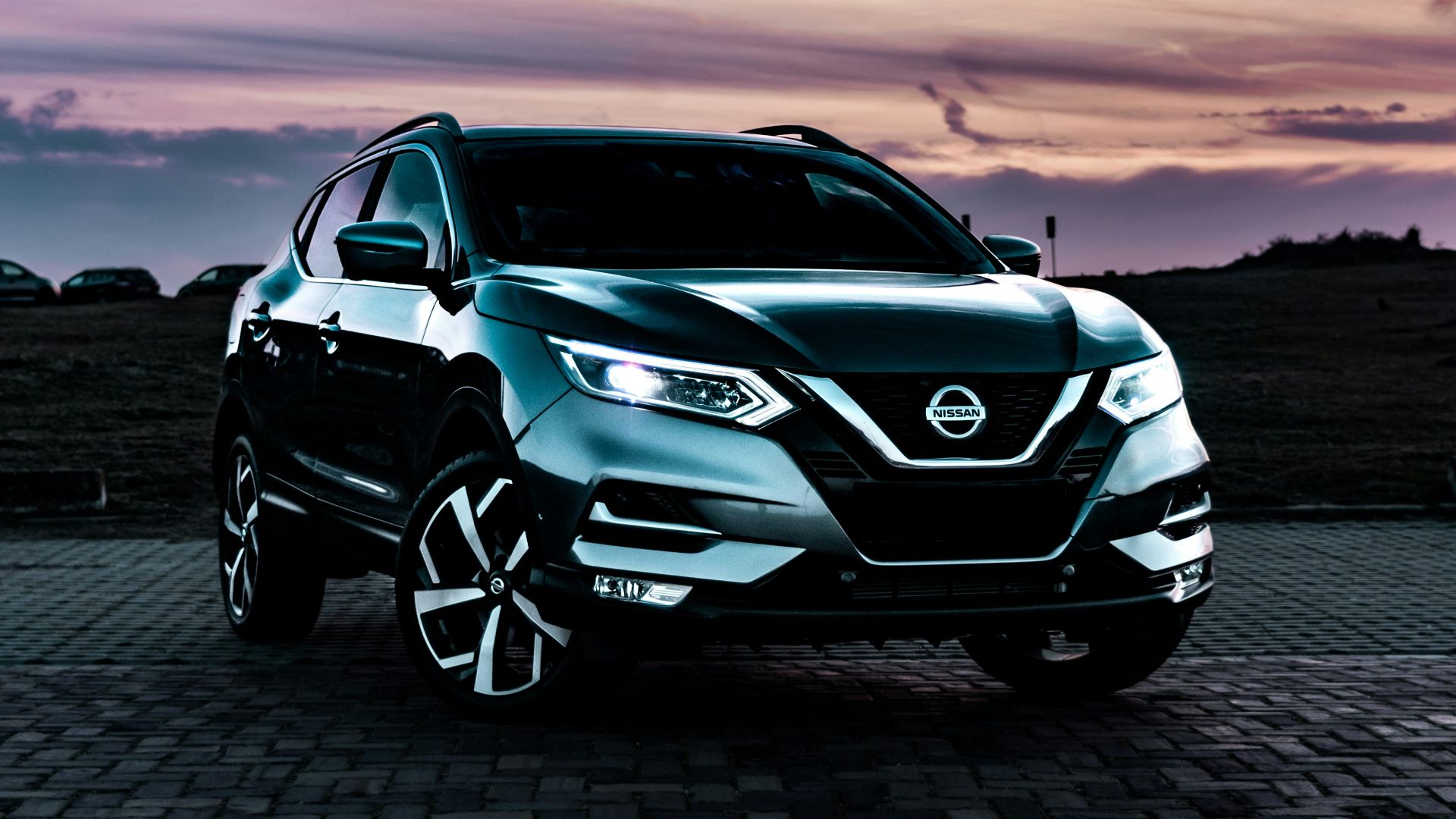 gray Nissan Rogue SUV outdoor during nighttime