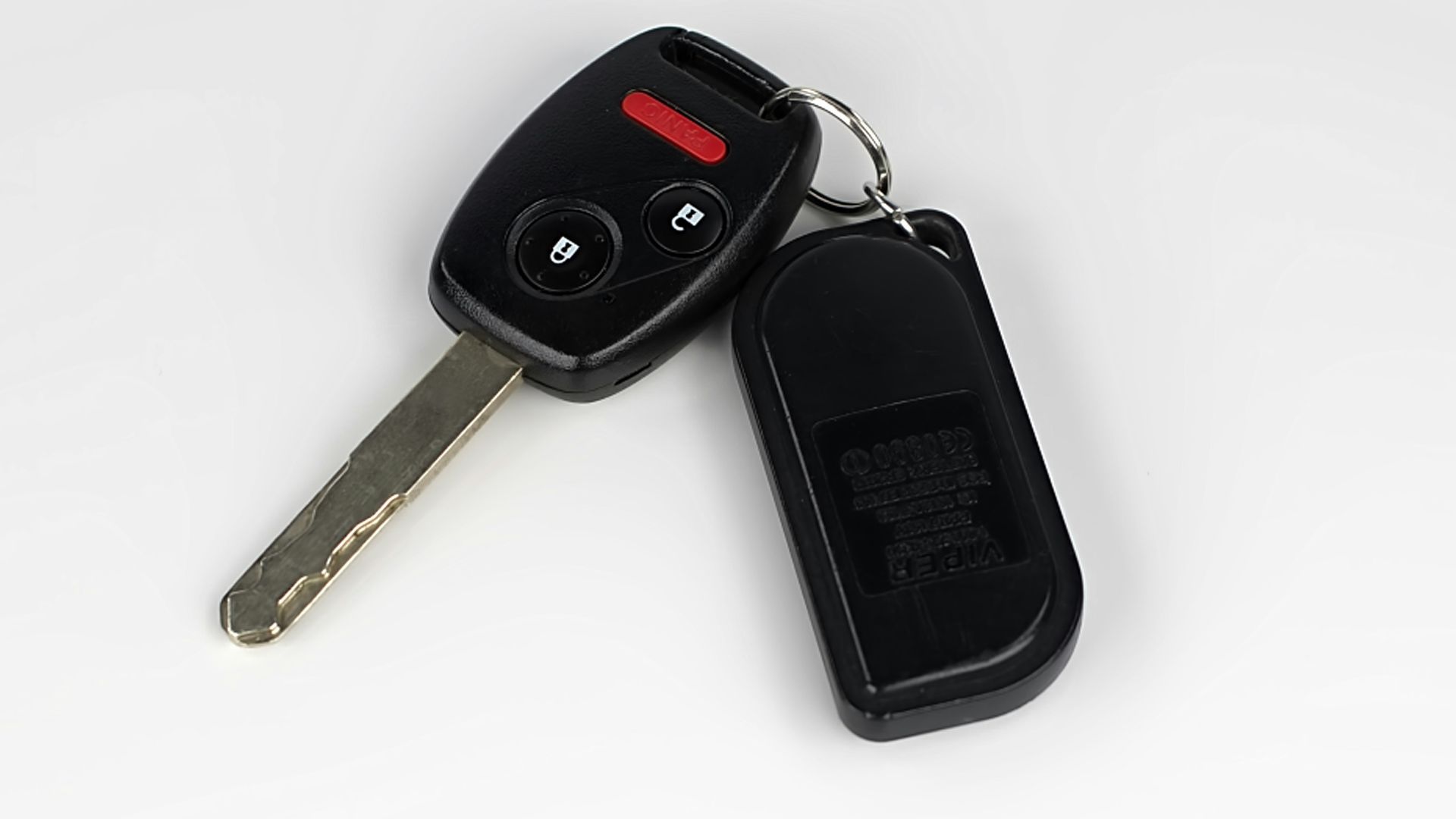 a car key with a remote control attached to it
