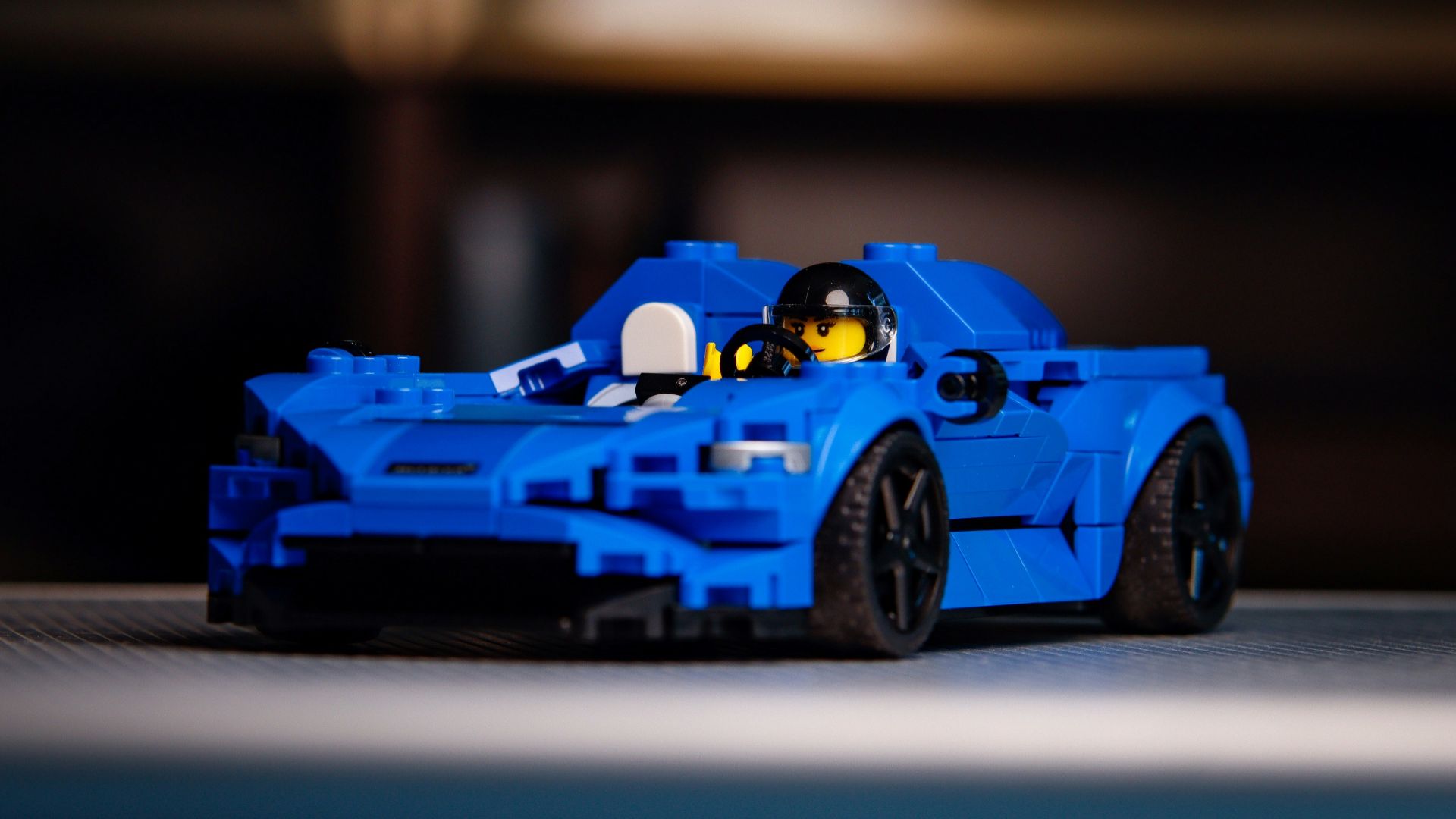 a blue lego race car on a table