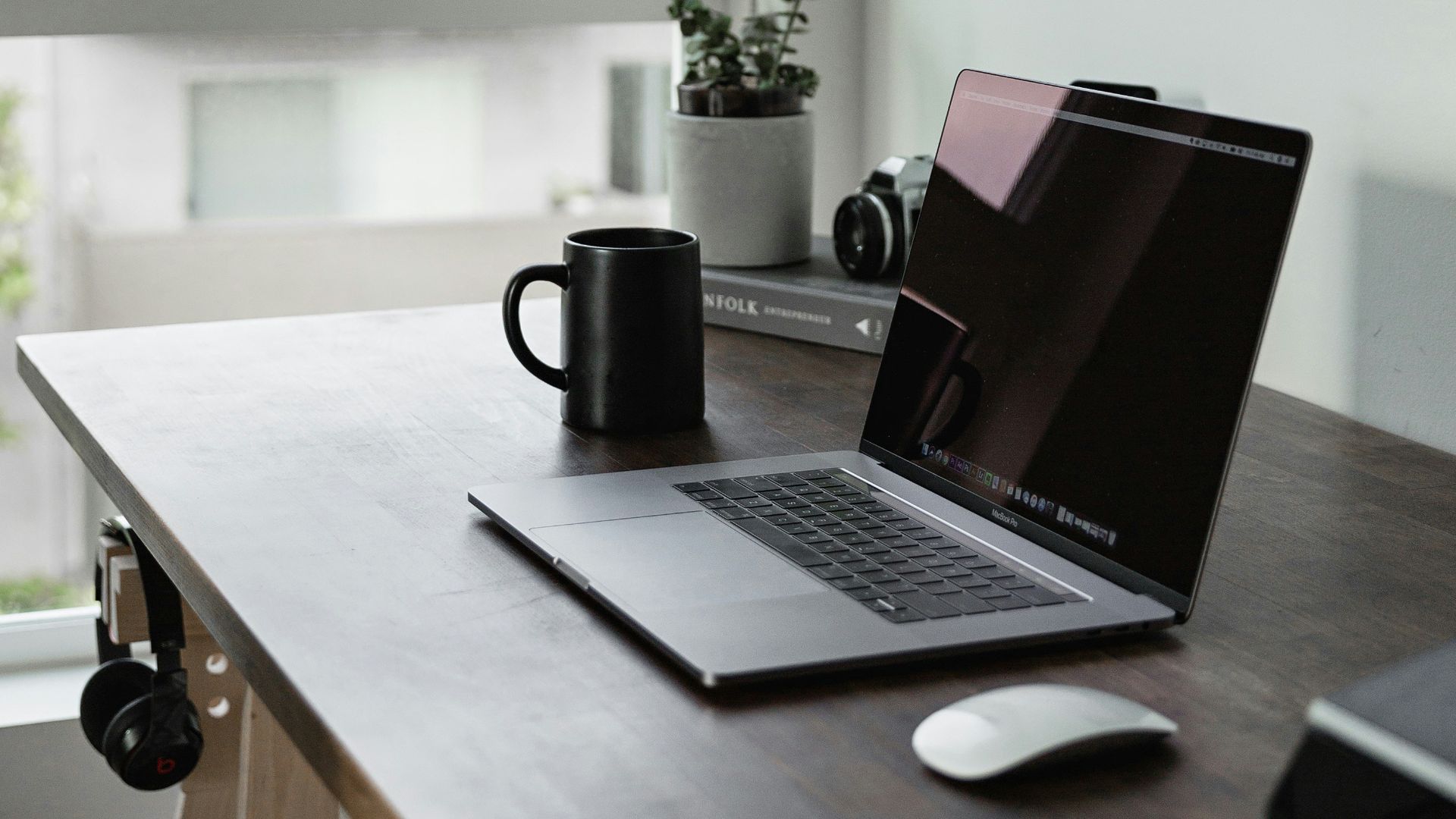 turned off laptop computer with near wall