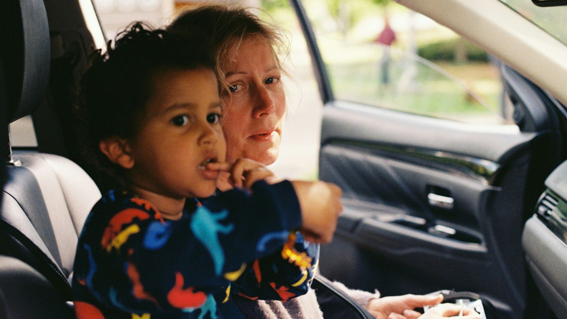 a person and a child in a car