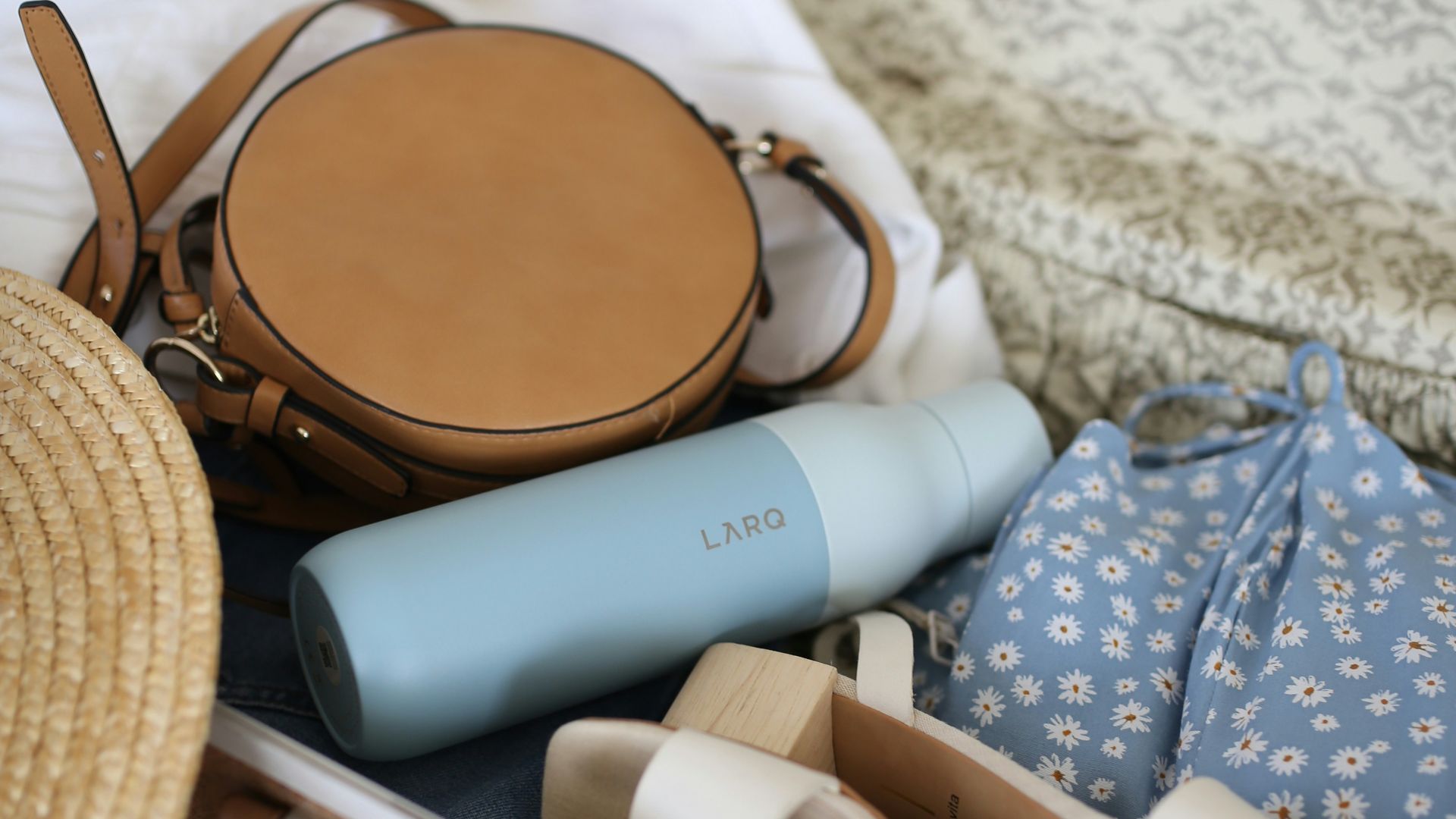 brown and gray leather suitcase