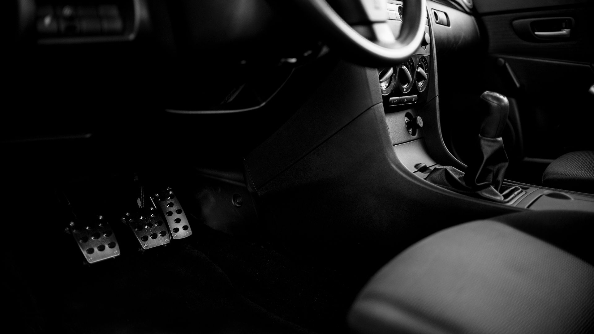 a black and white photo of the inside of a car