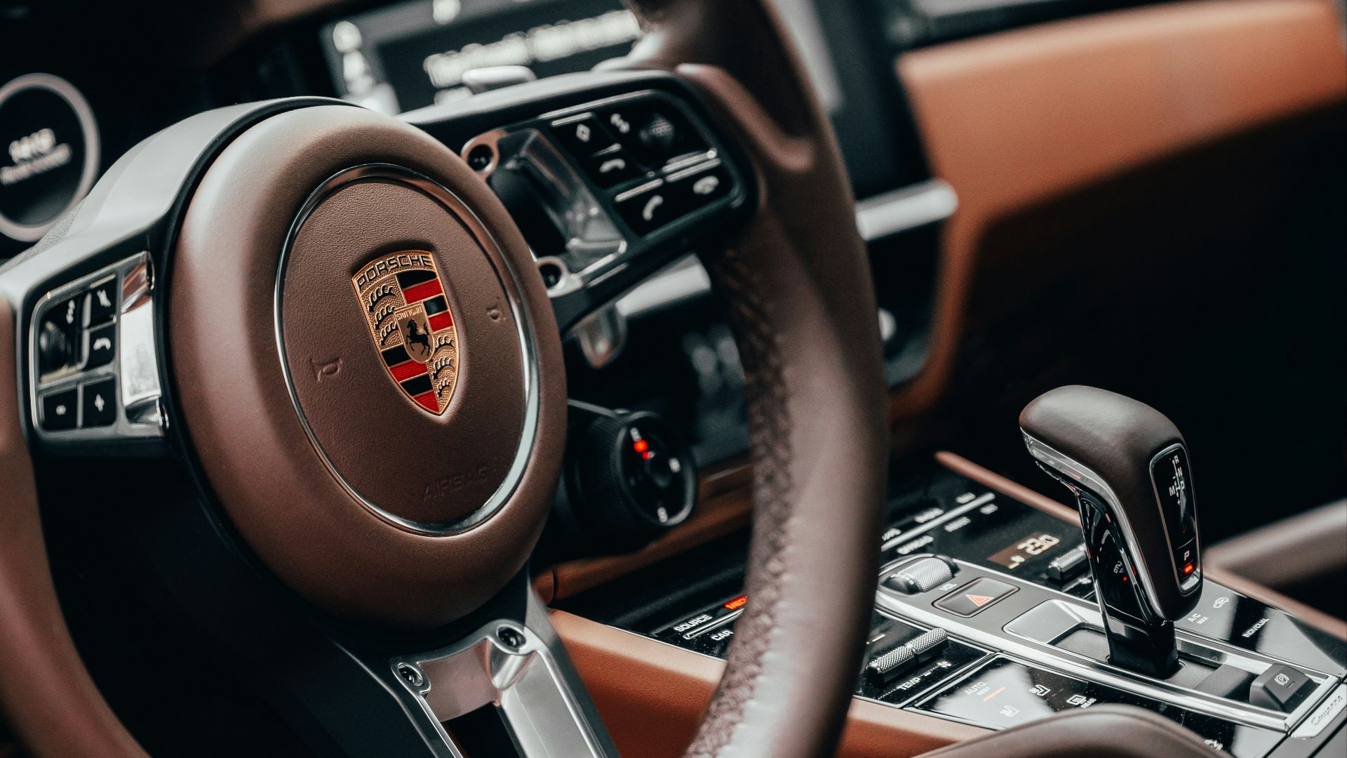black and brown nissan steering wheel