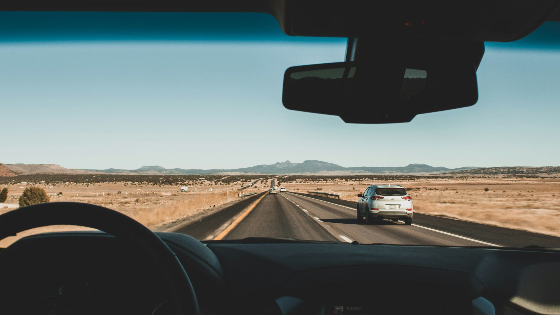 running vehicles on road during daytime