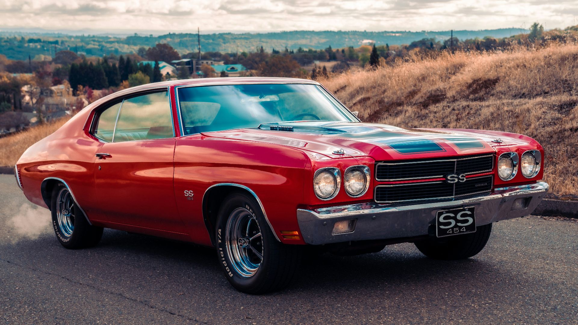 red chevrolet camaro on road during daytime