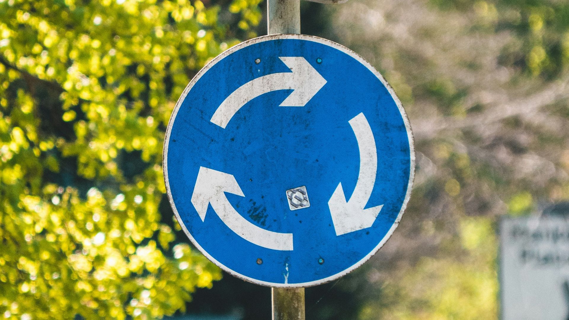 blue and white road sign