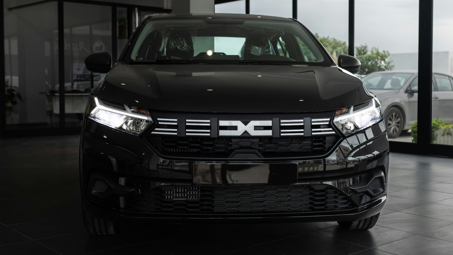 A black car is parked in a garage