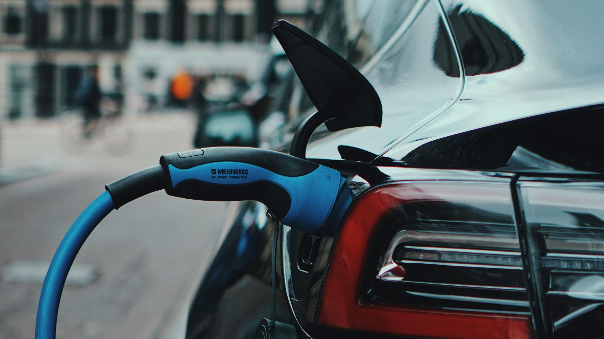 white and black car in front of white building during daytime