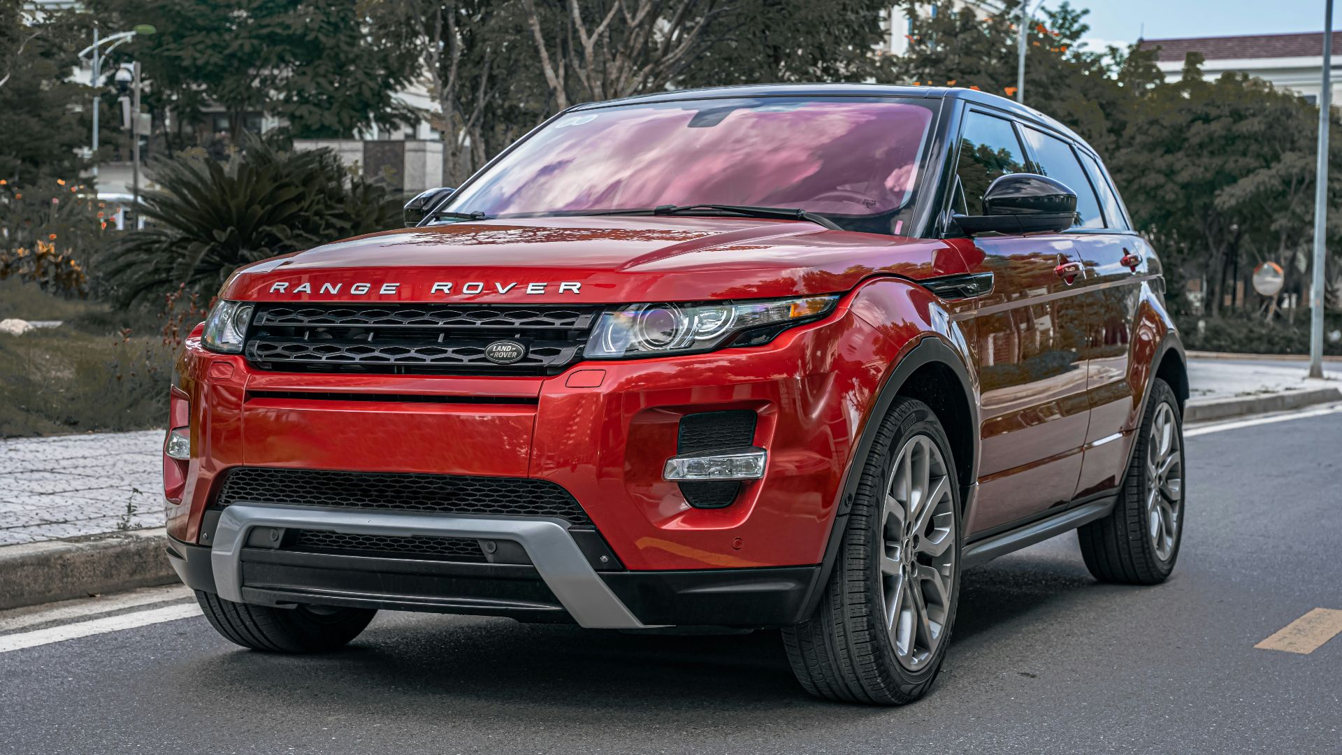 a red car parked on the side of the road