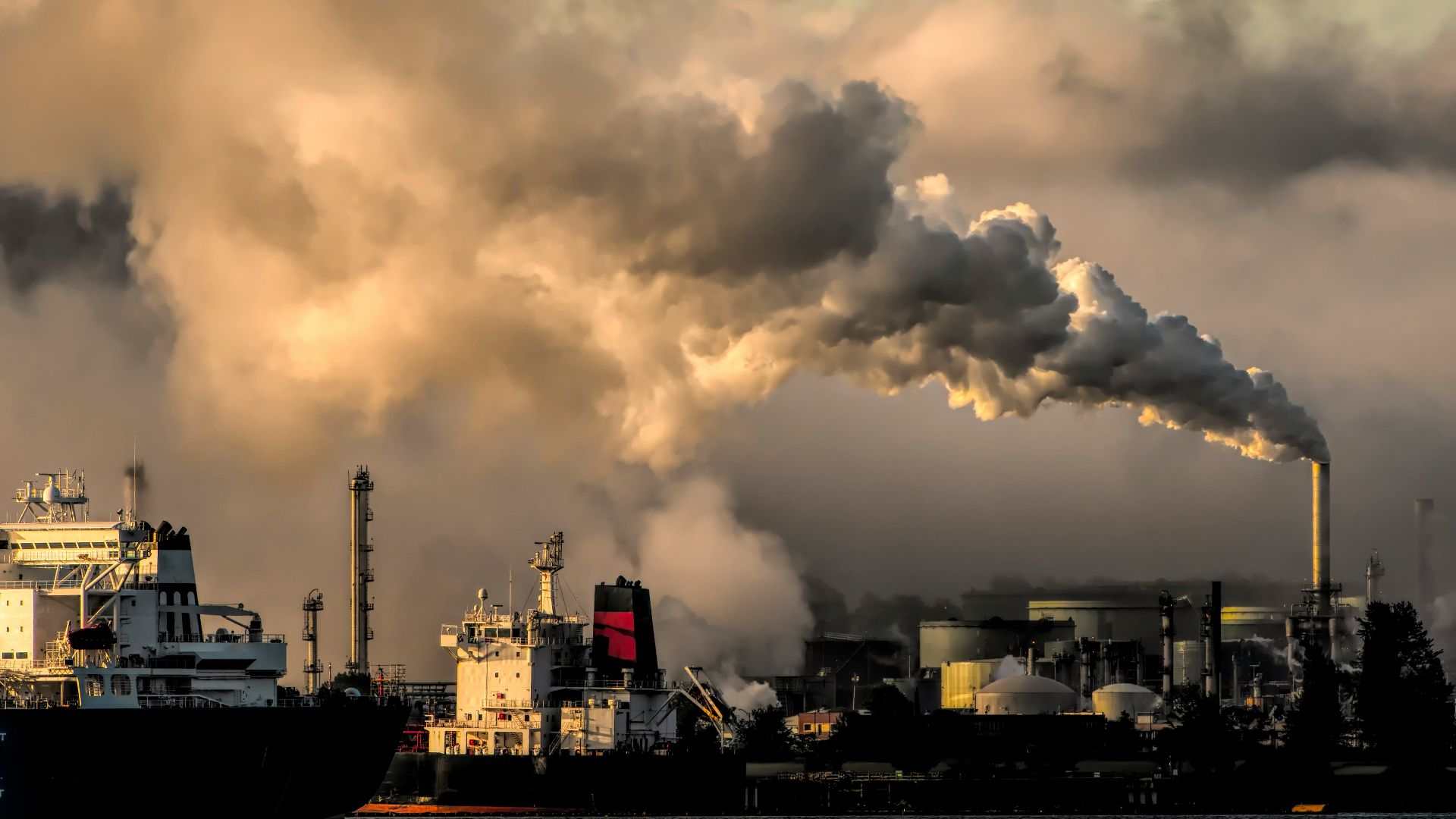 white and black ship on sea under white clouds