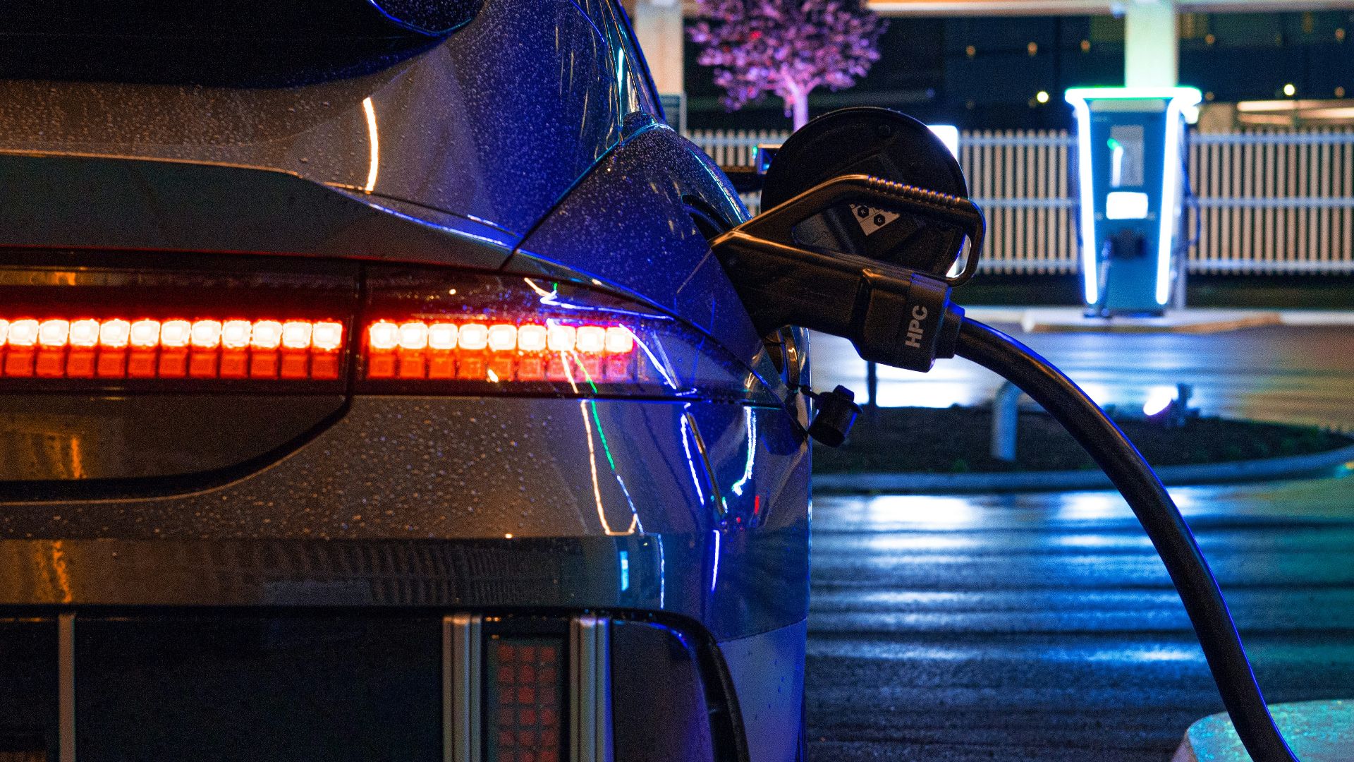 an electric car plugged in to a charging station