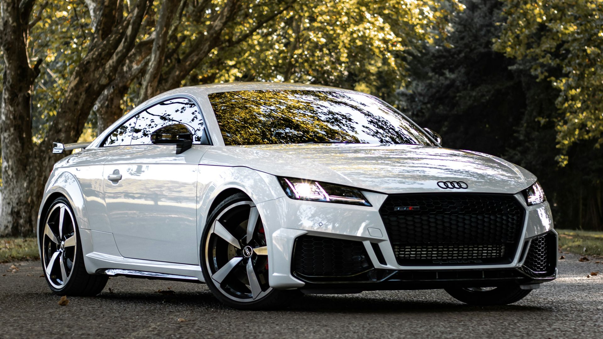 white bmw m 3 coupe parked on gray concrete road during daytime