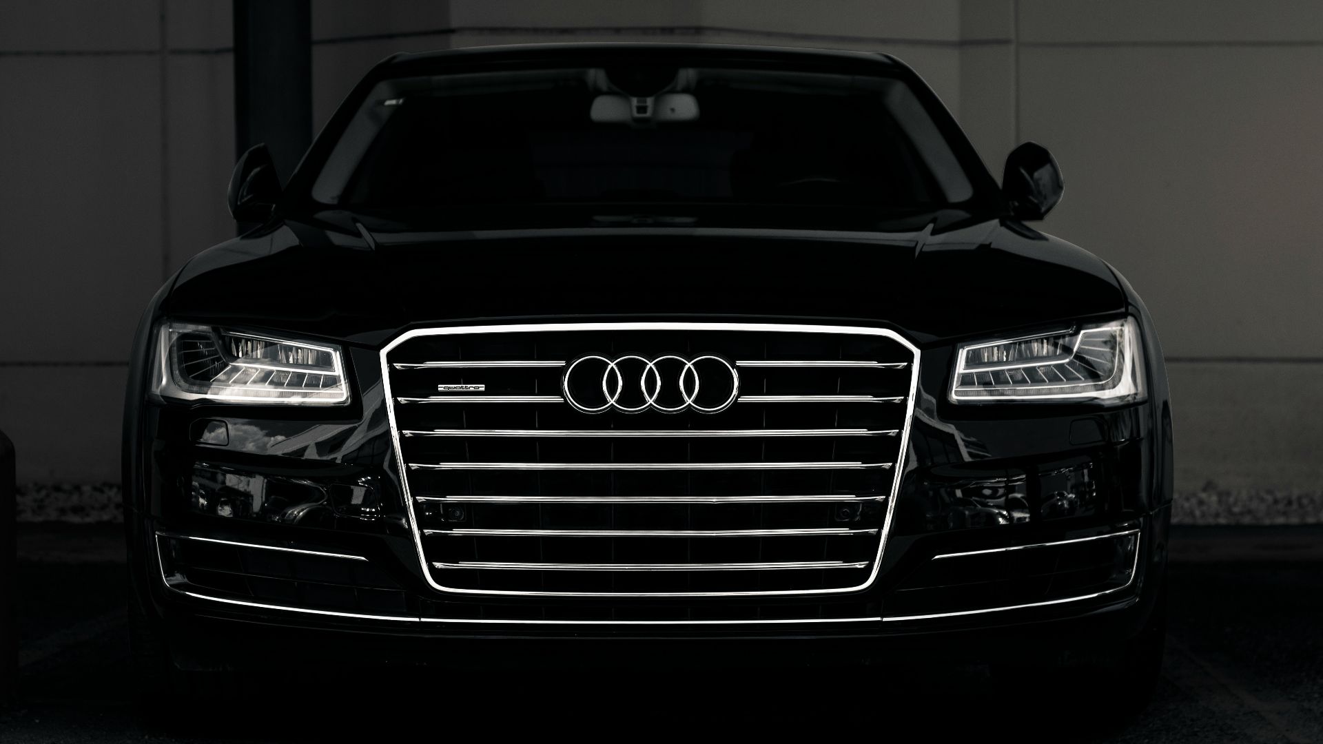 a black and white photo of an audi car