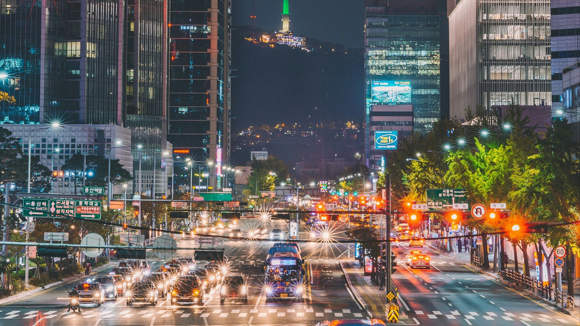car passing through road beside building