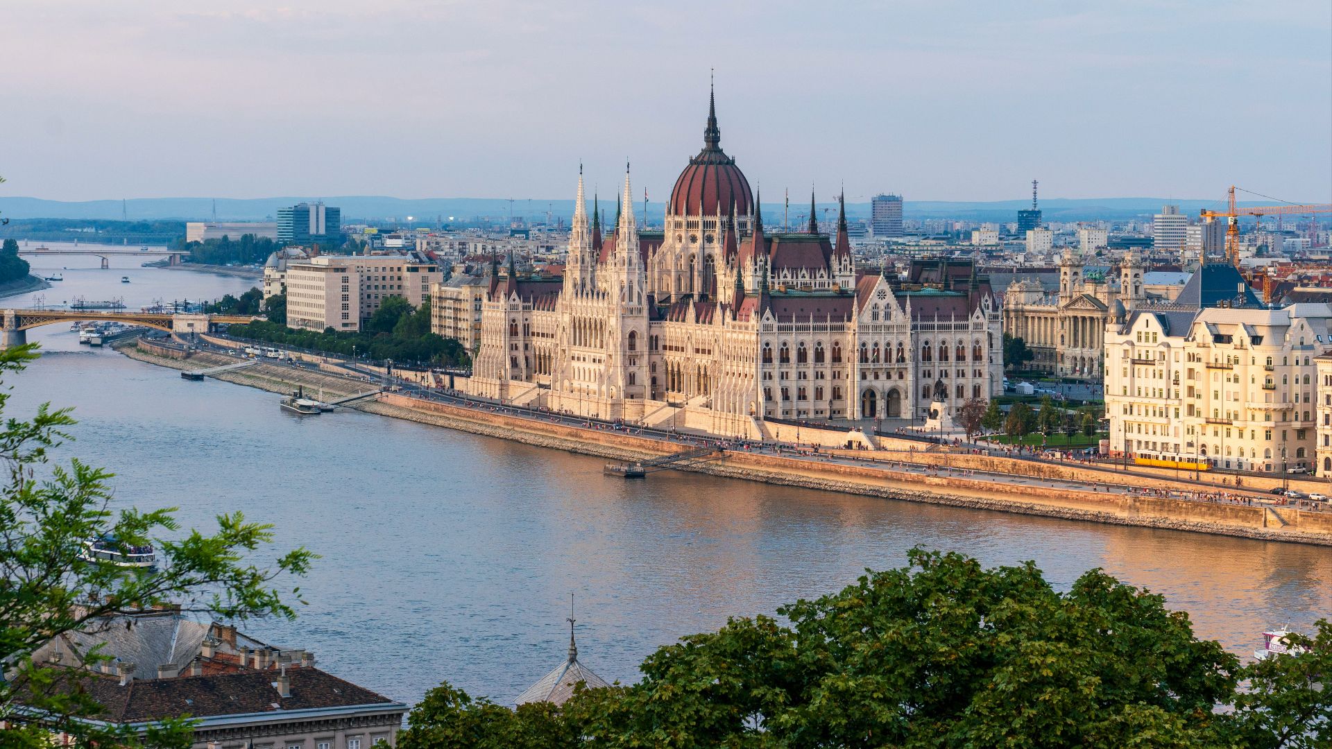 brown concrete building near body of water during daytime
