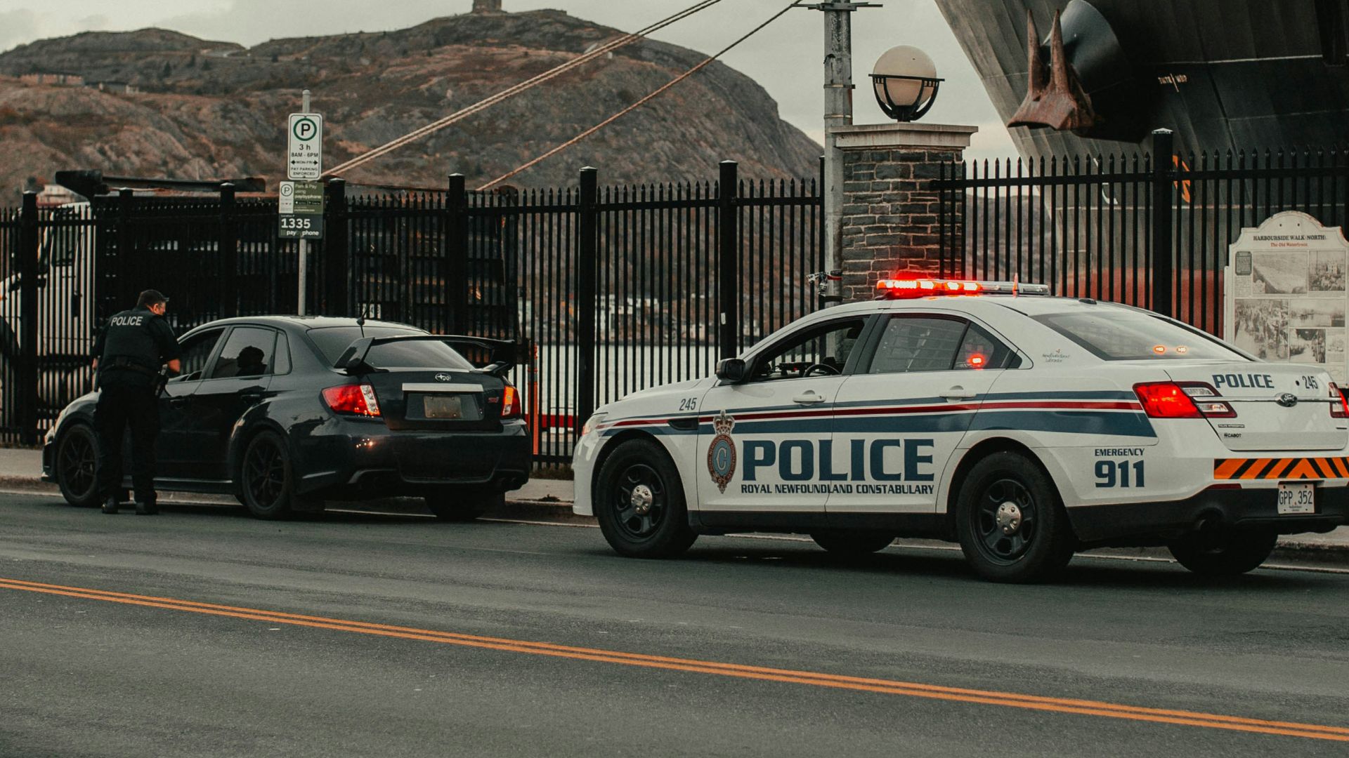white and blue police car on road