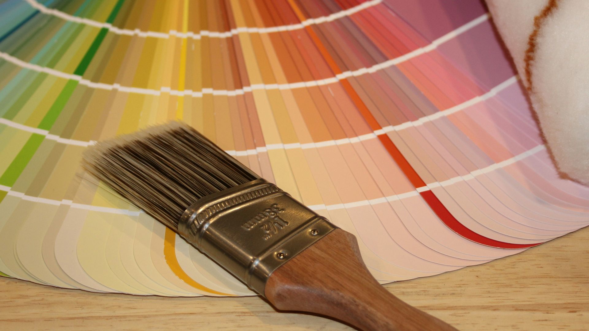brown paint brush on white and red plaid textile