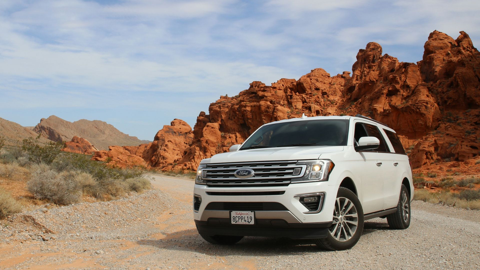 parked white Ford Explorer SUV
