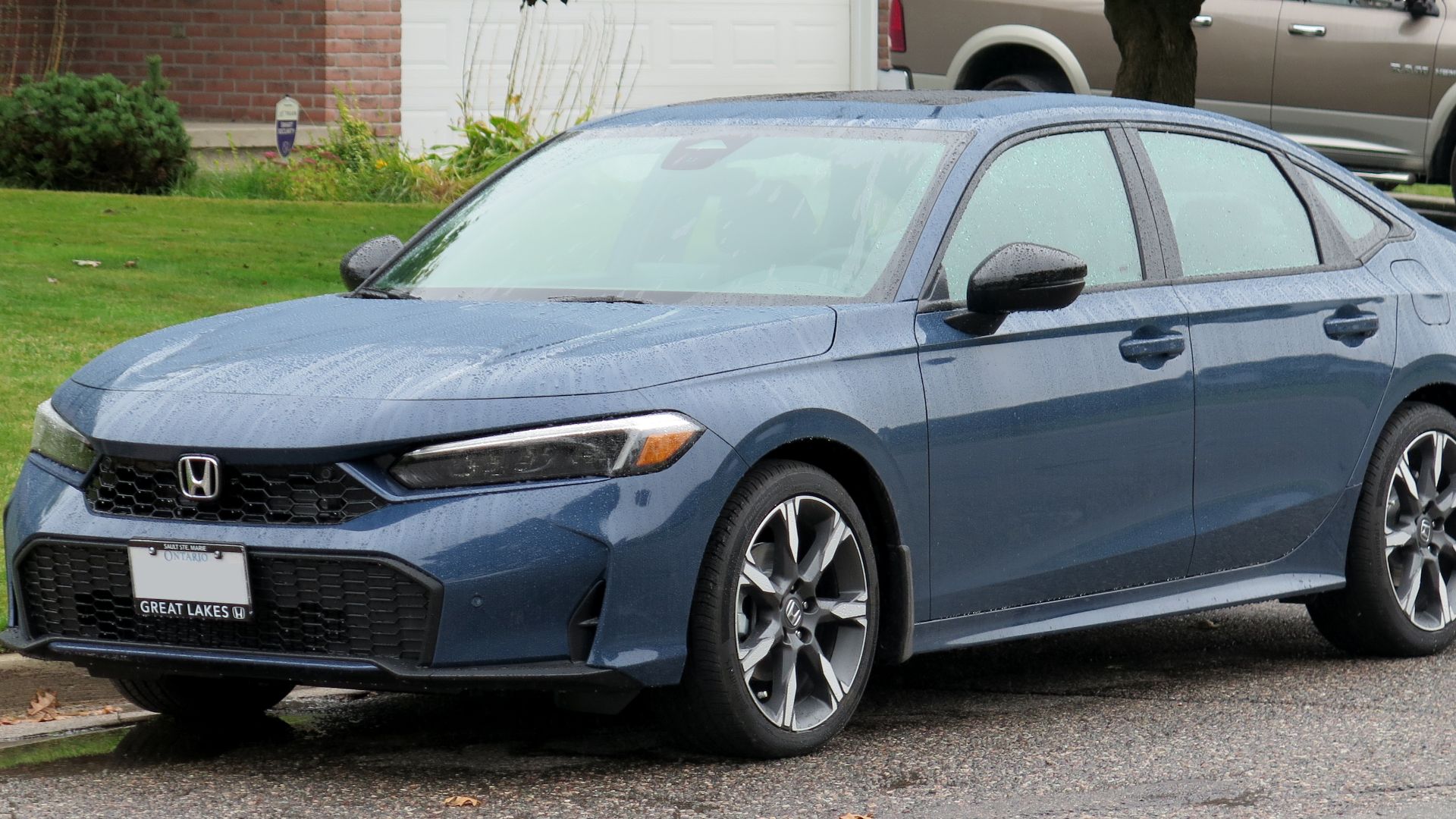 File:2025 Honda Civic Sport Touring Hybrid in Blue Lagoon, front left, 2024-09-24.jpg