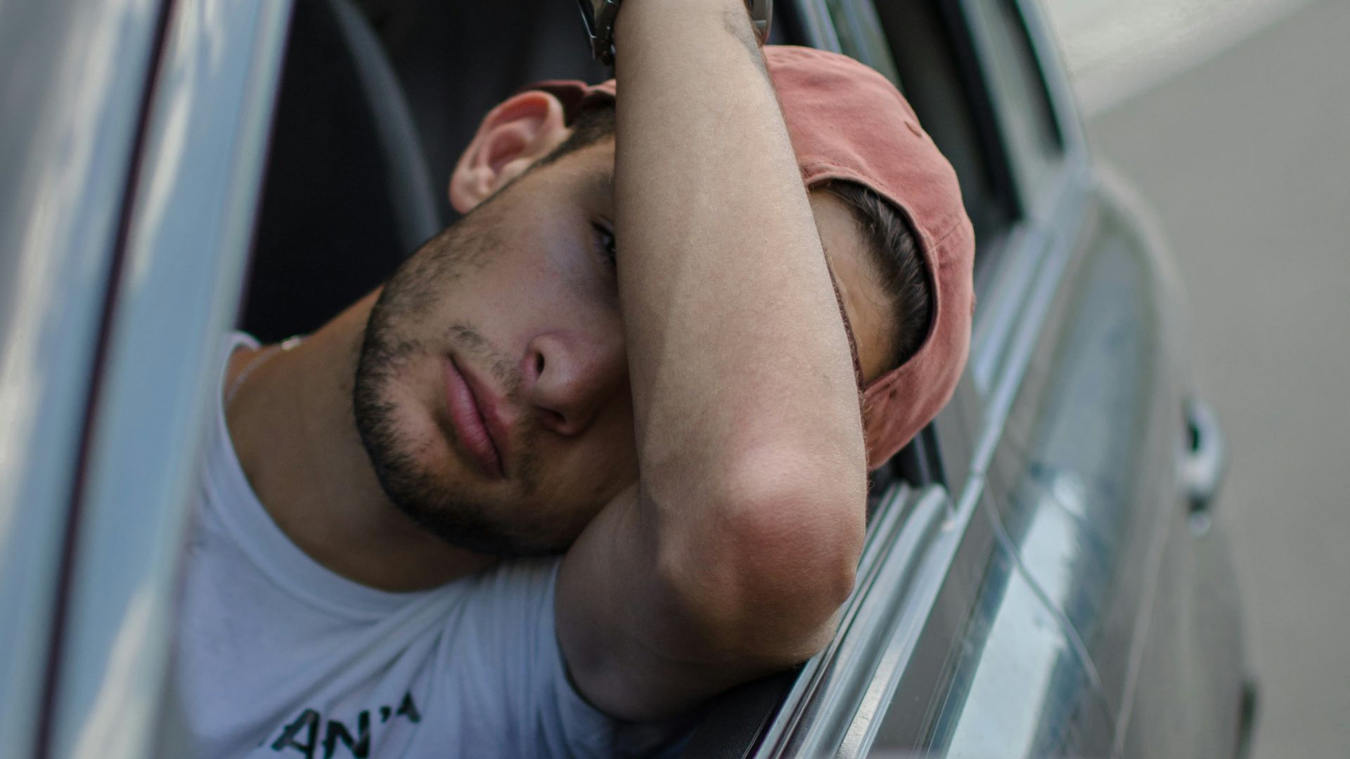 man sitting inside car