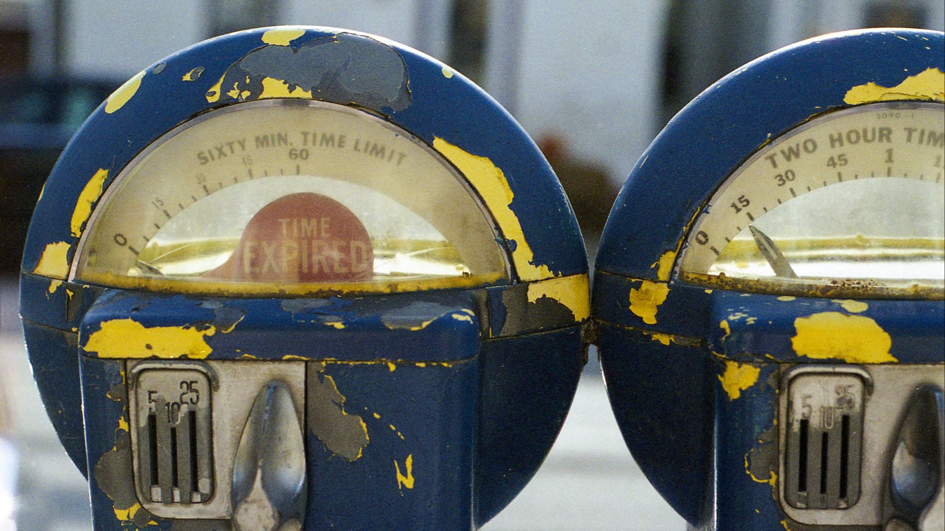 two round blue-gray-and-yellow analog devices