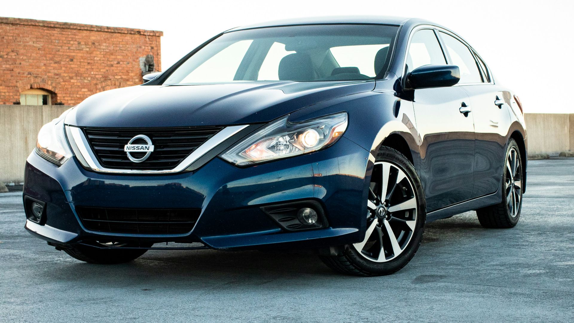 white bmw m 3 coupe parked on gray concrete pavement during daytime