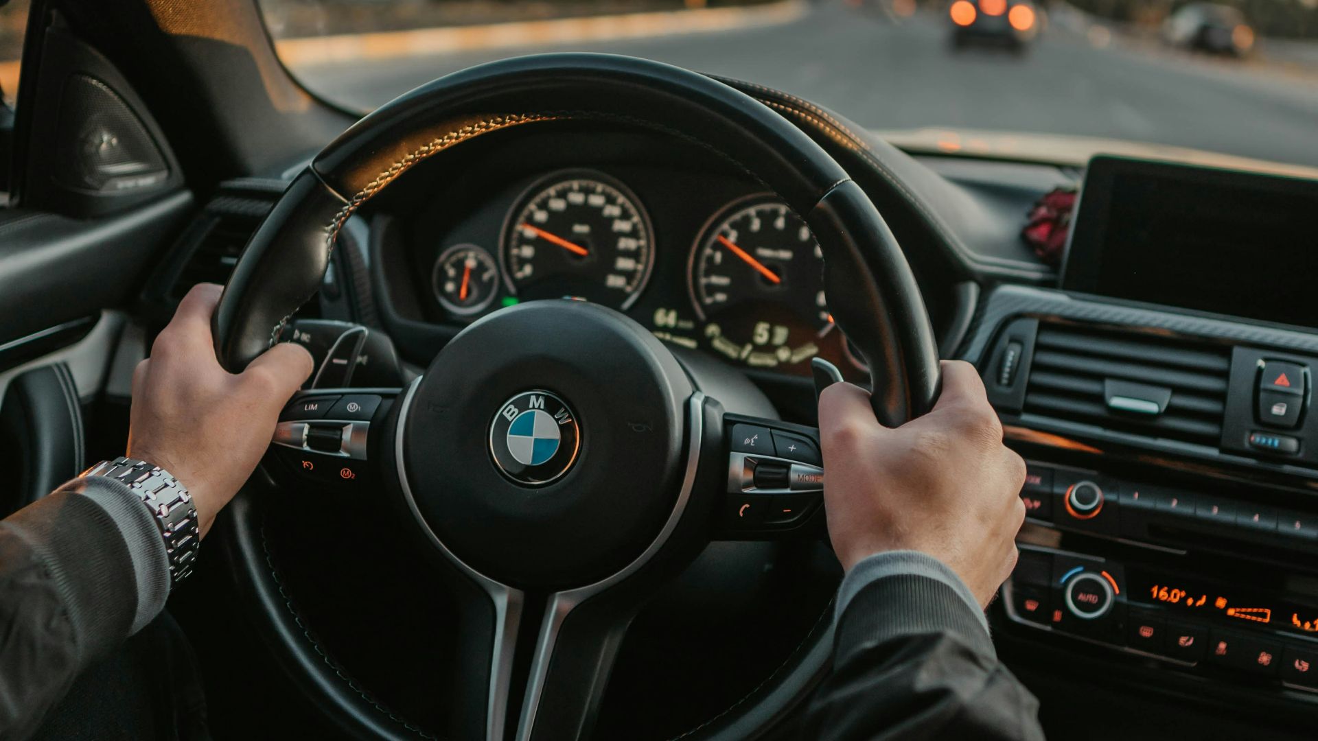 unknown person driving BMW car