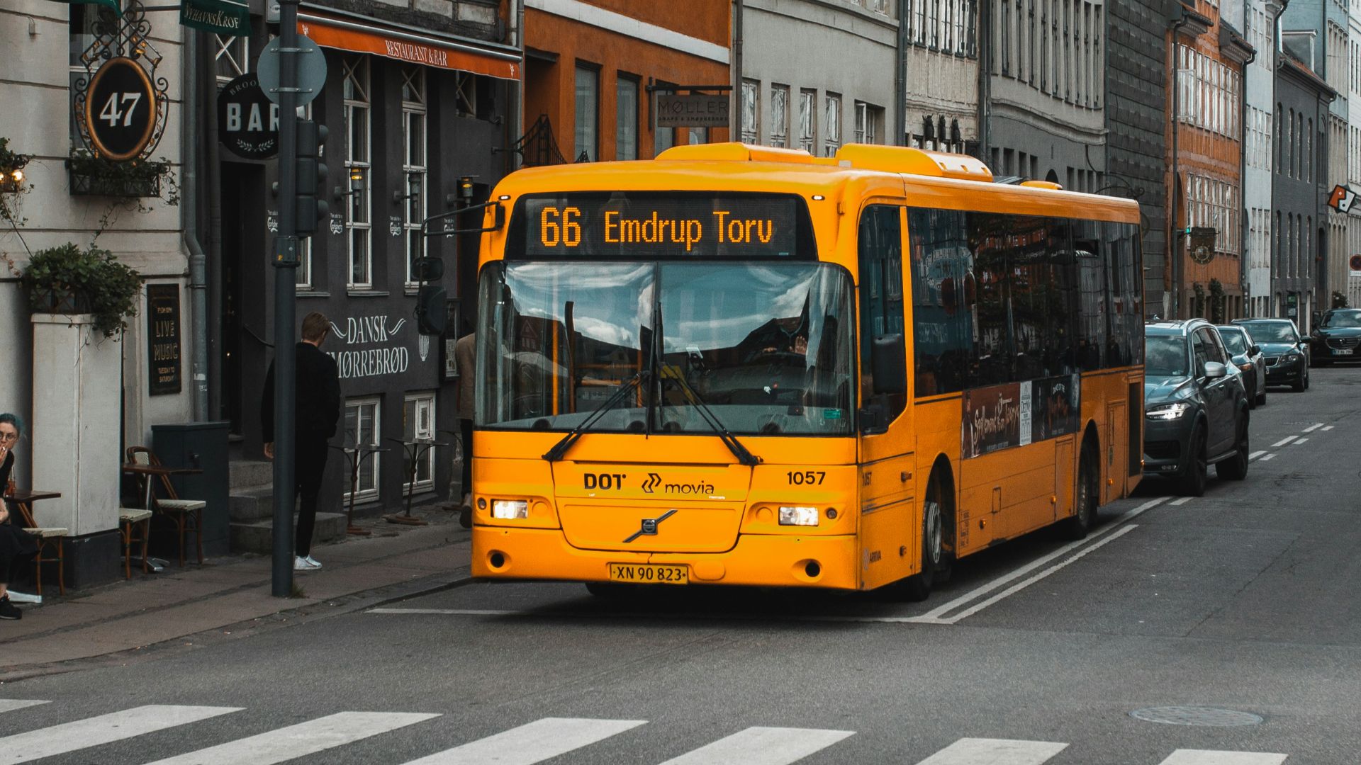 yellow and black bus on road at daytime