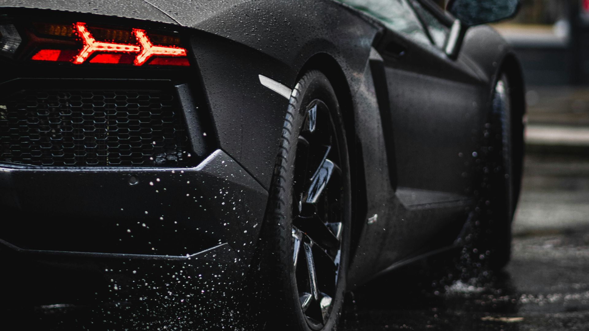 black porsche 911 parked on street during daytime