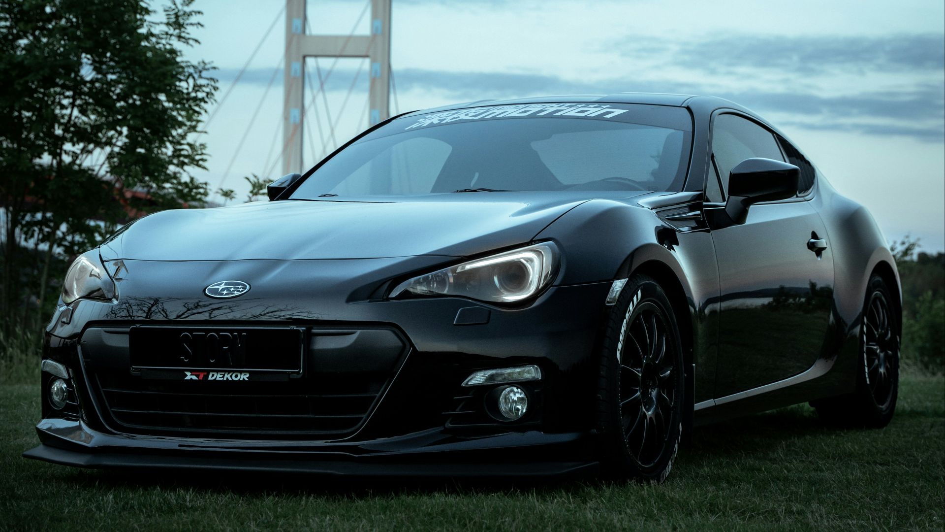black mercedes benz coupe on green grass field during daytime