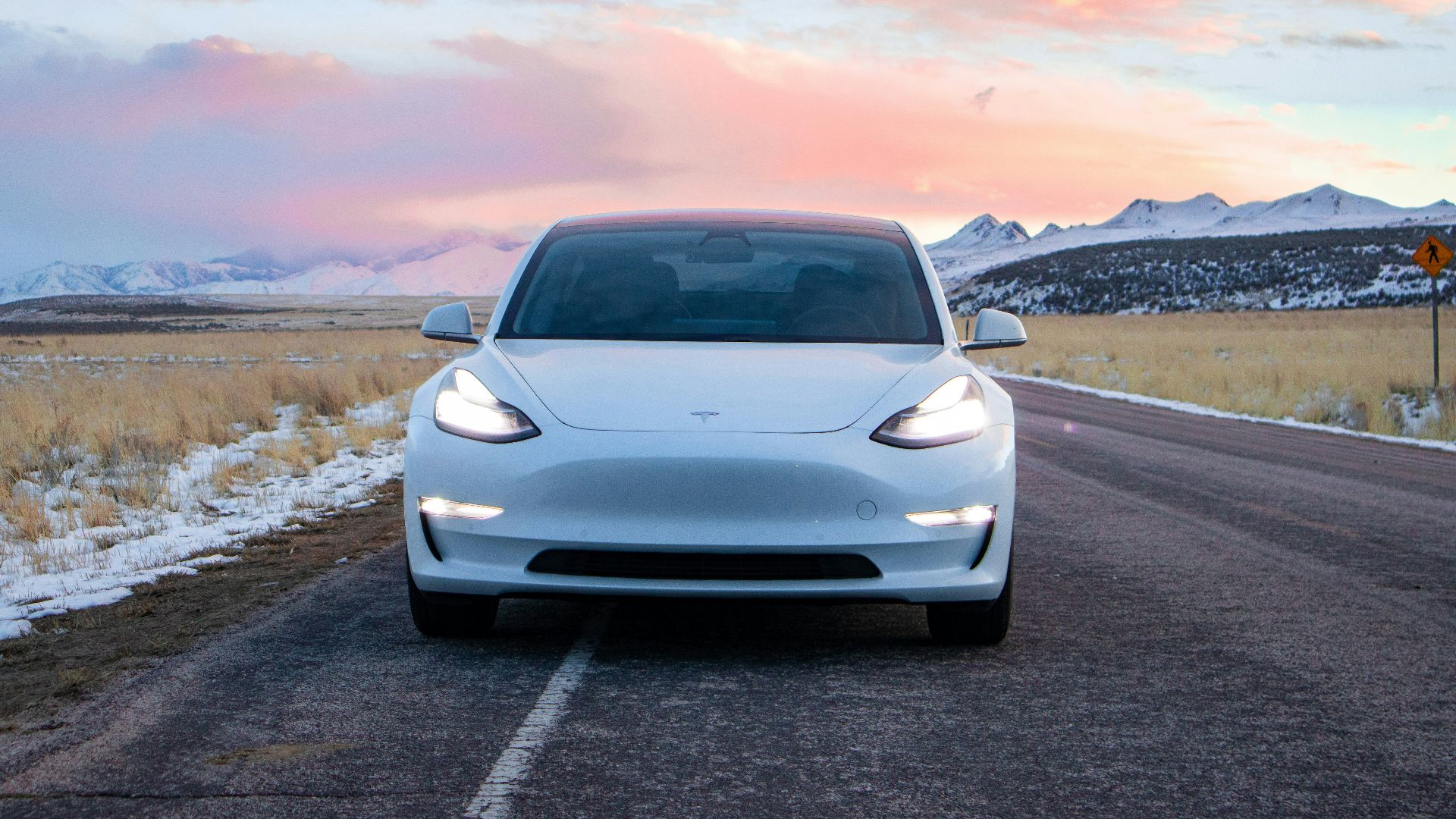 white car on asphalt road during daytime