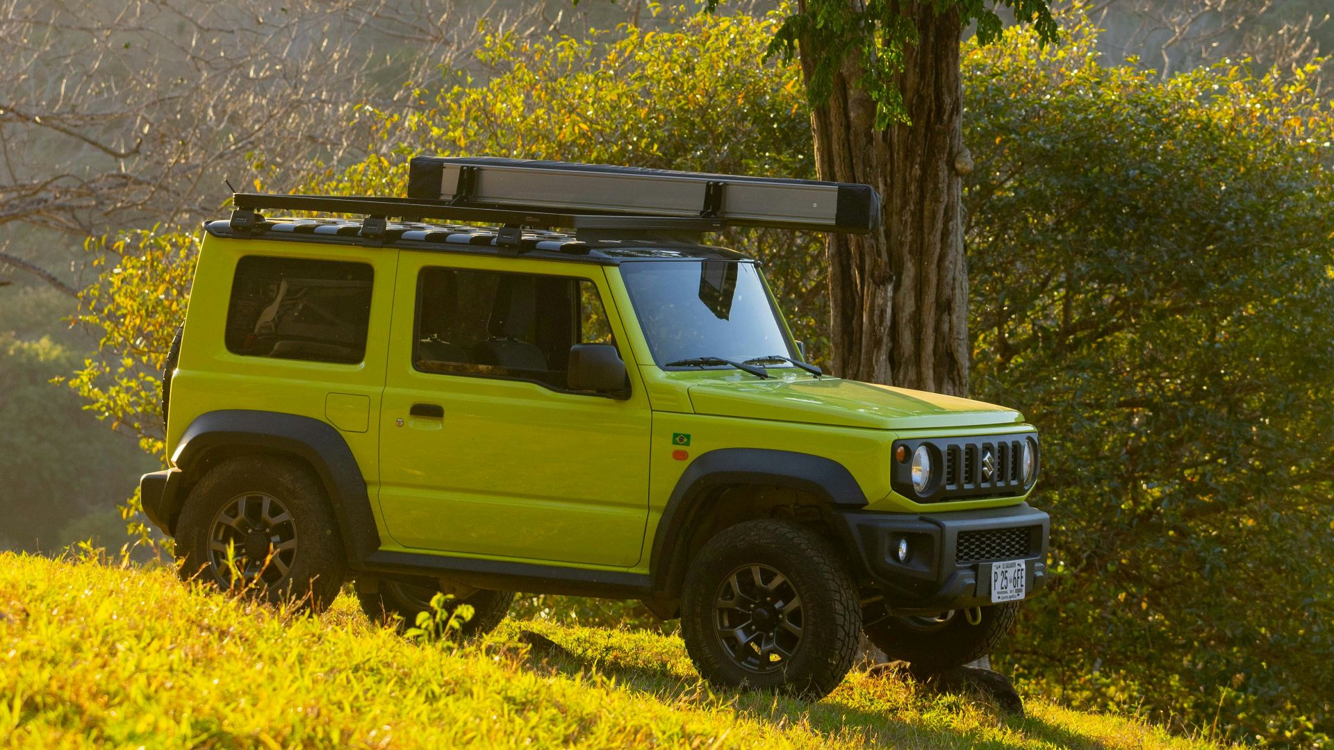 a bright green jeep is parked in a field