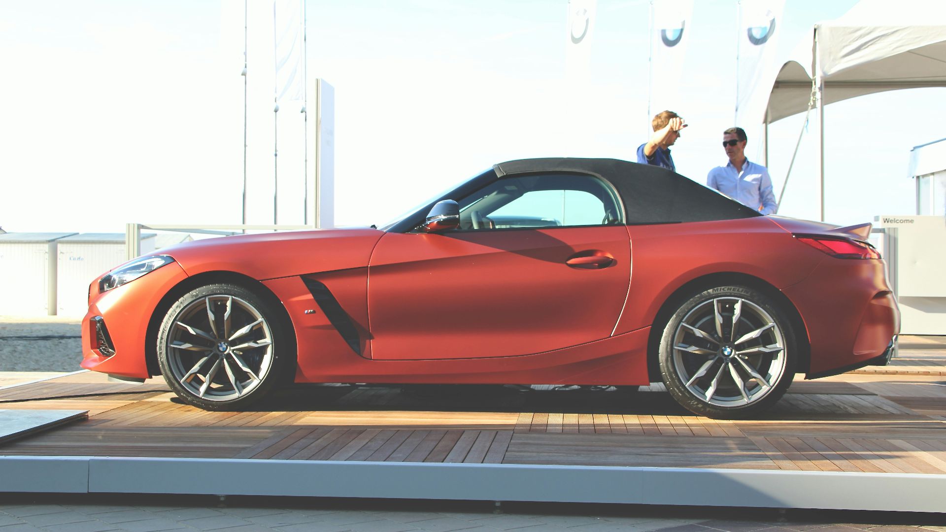 red ferrari coupe on a parking lot