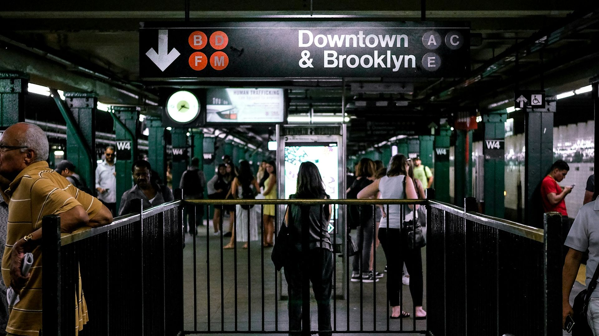 people walking at train station