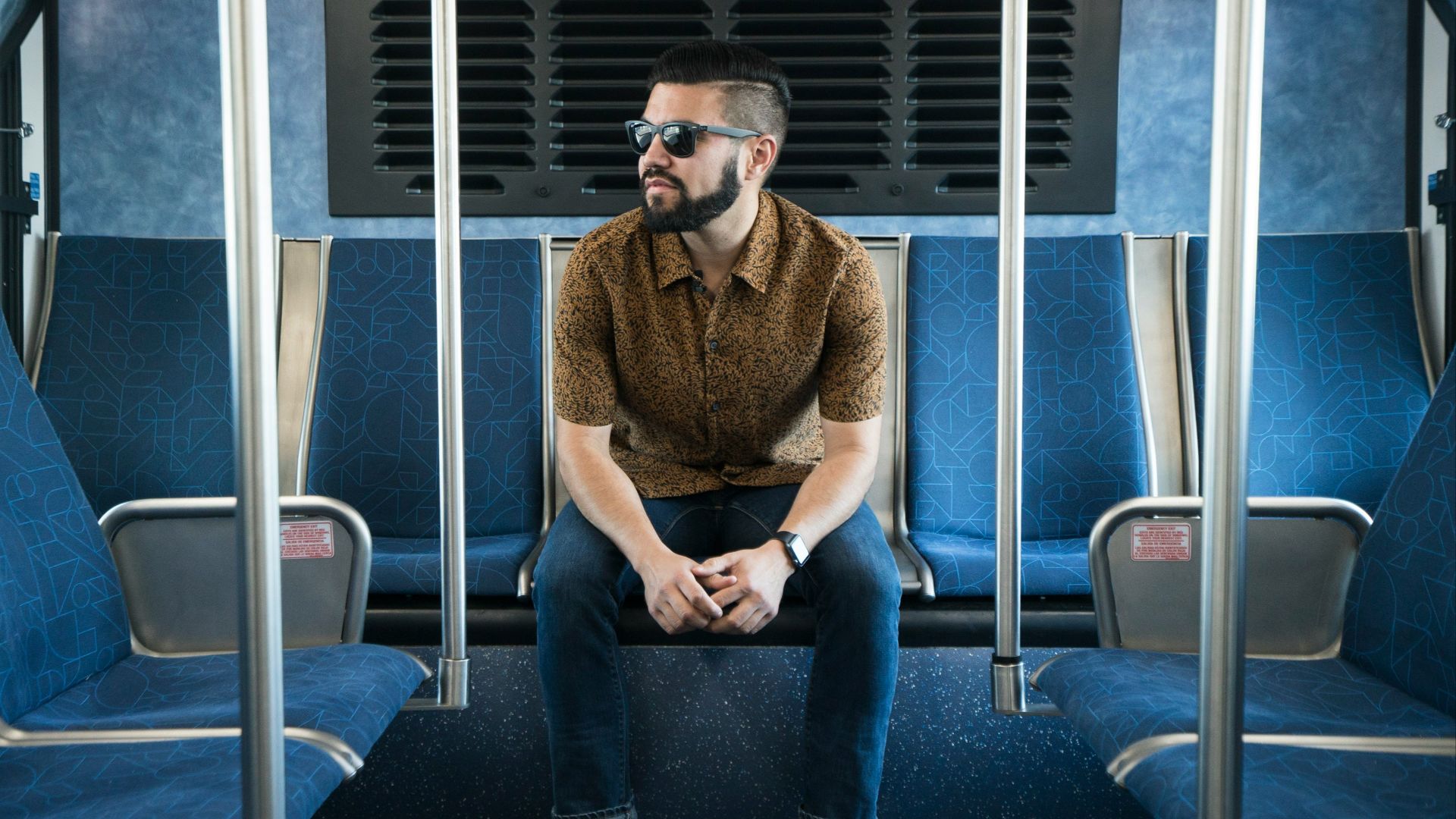man sitting on gang chair