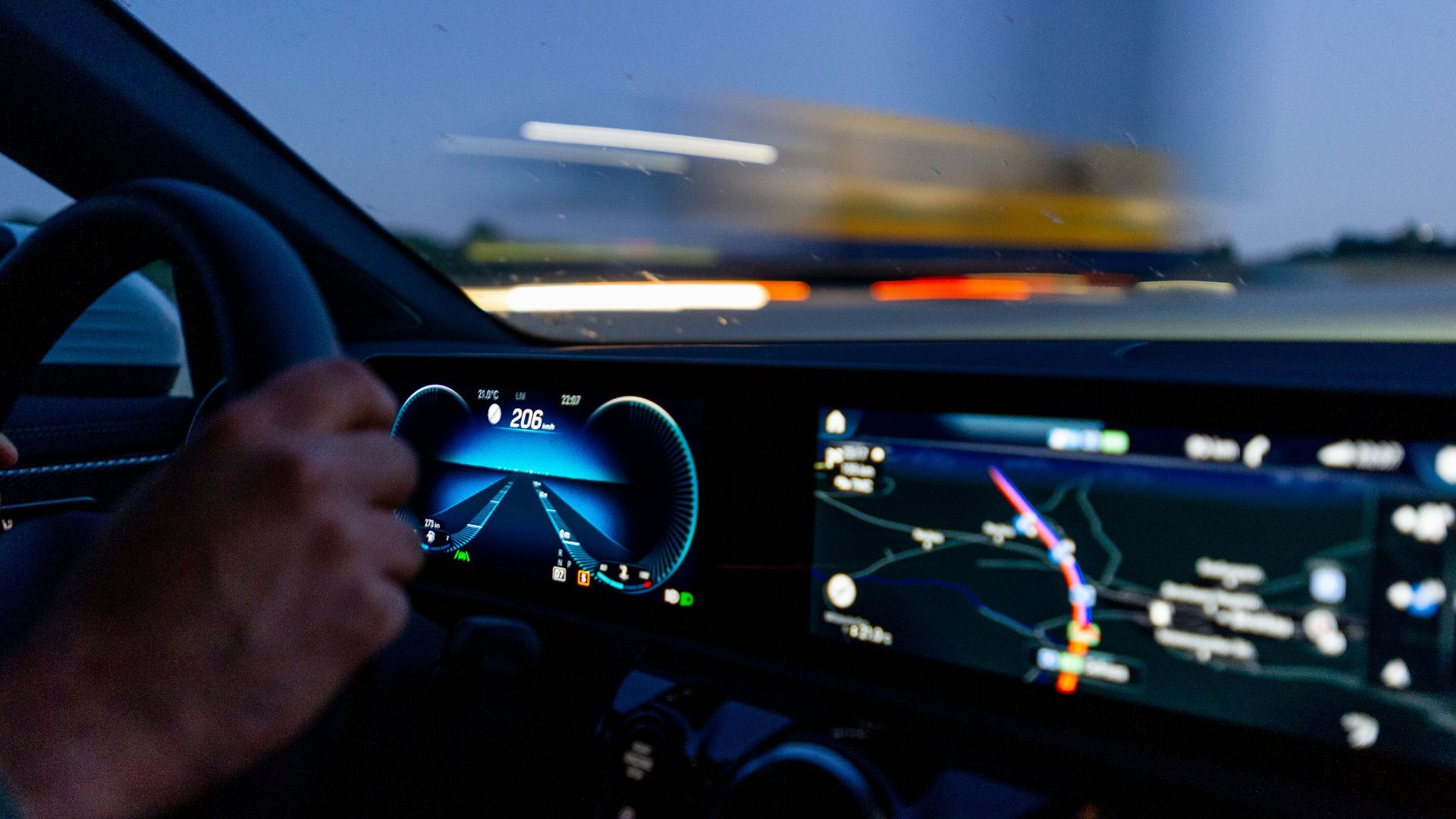 person's hand on steering wheel