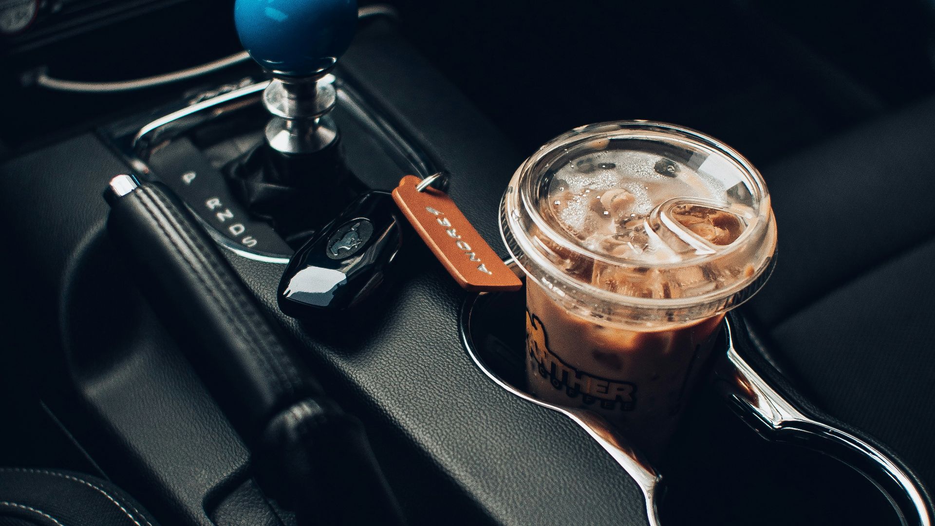 clear glass cup with brown liquid inside