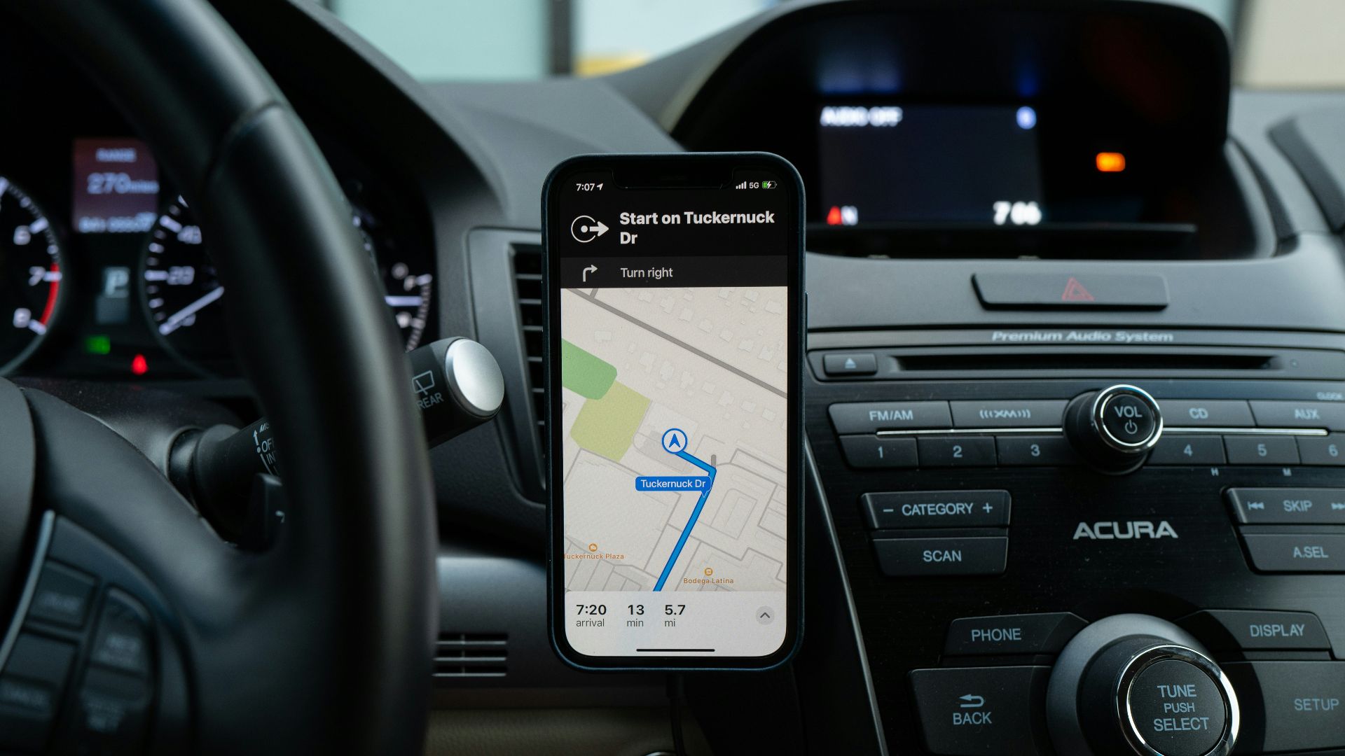 black android smartphone on car center console