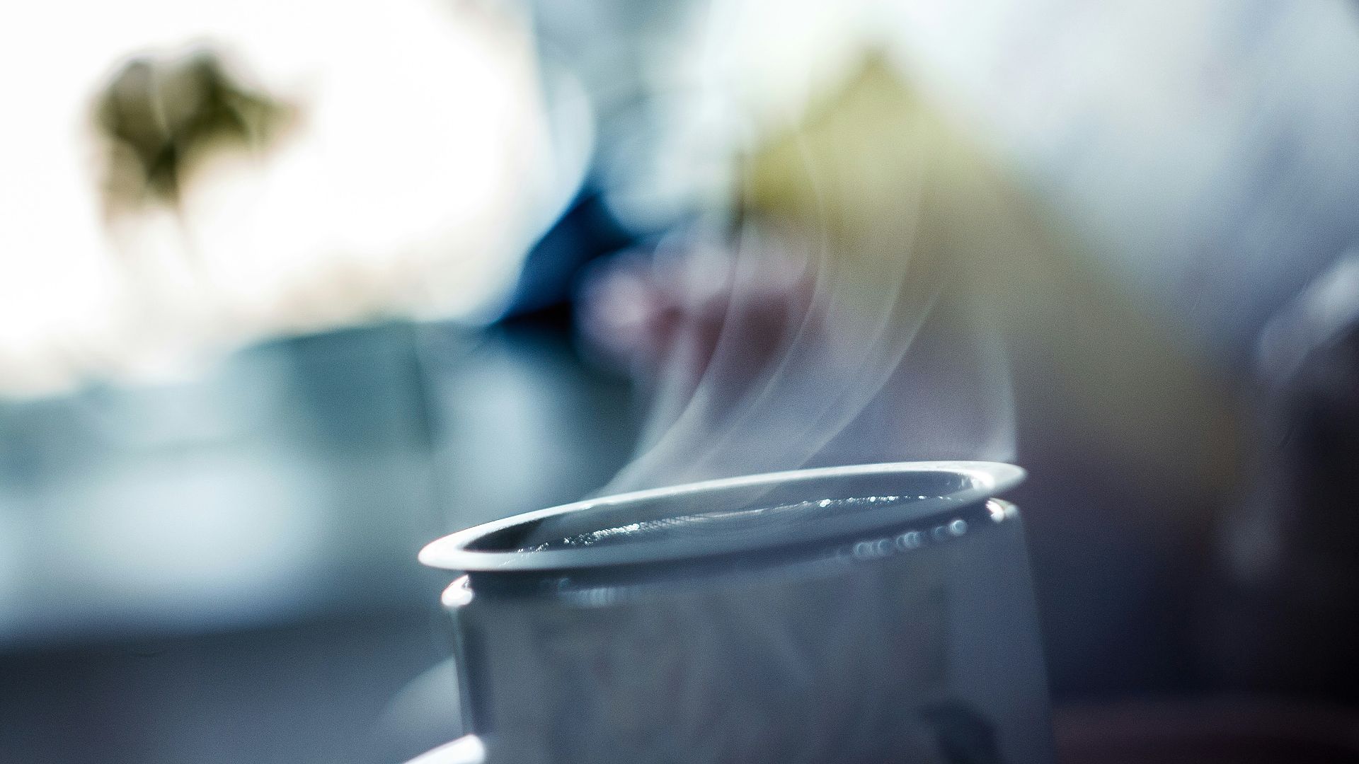 close-up photography of gray metal container with smoke