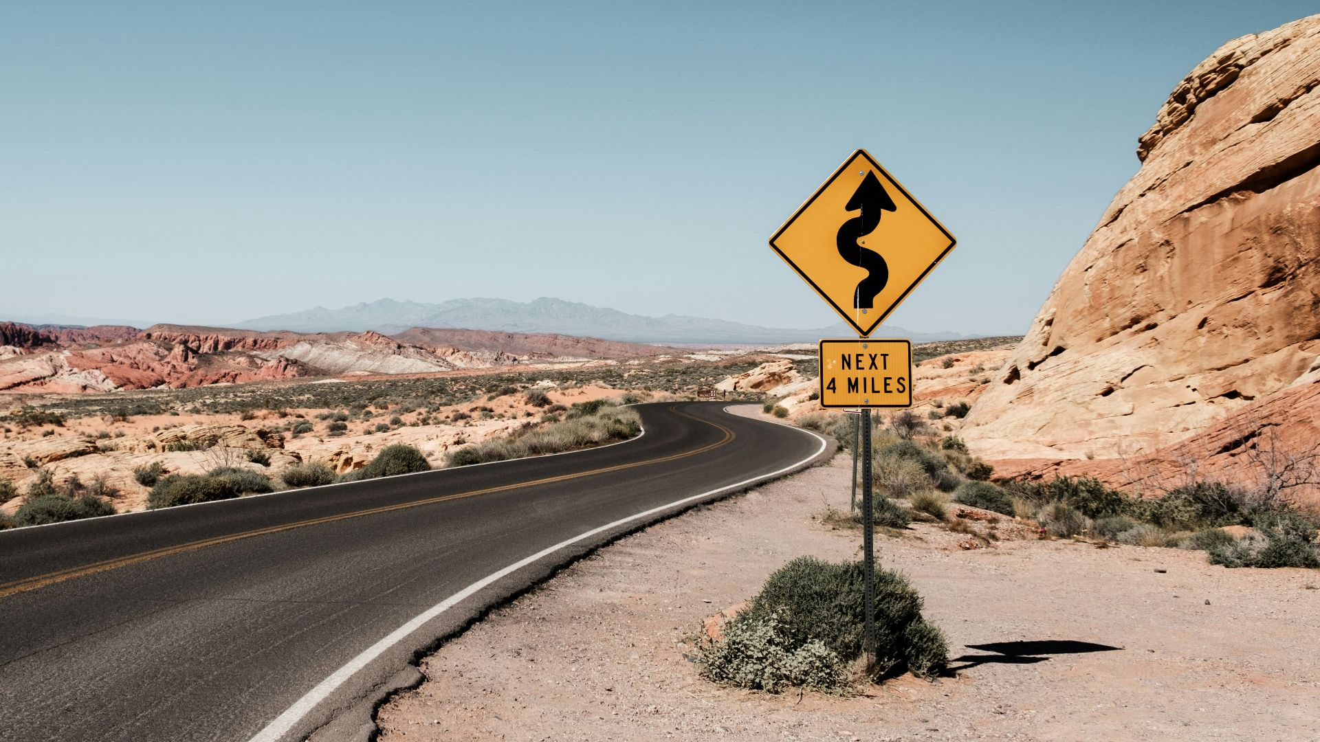 yellow and black zigzag signage