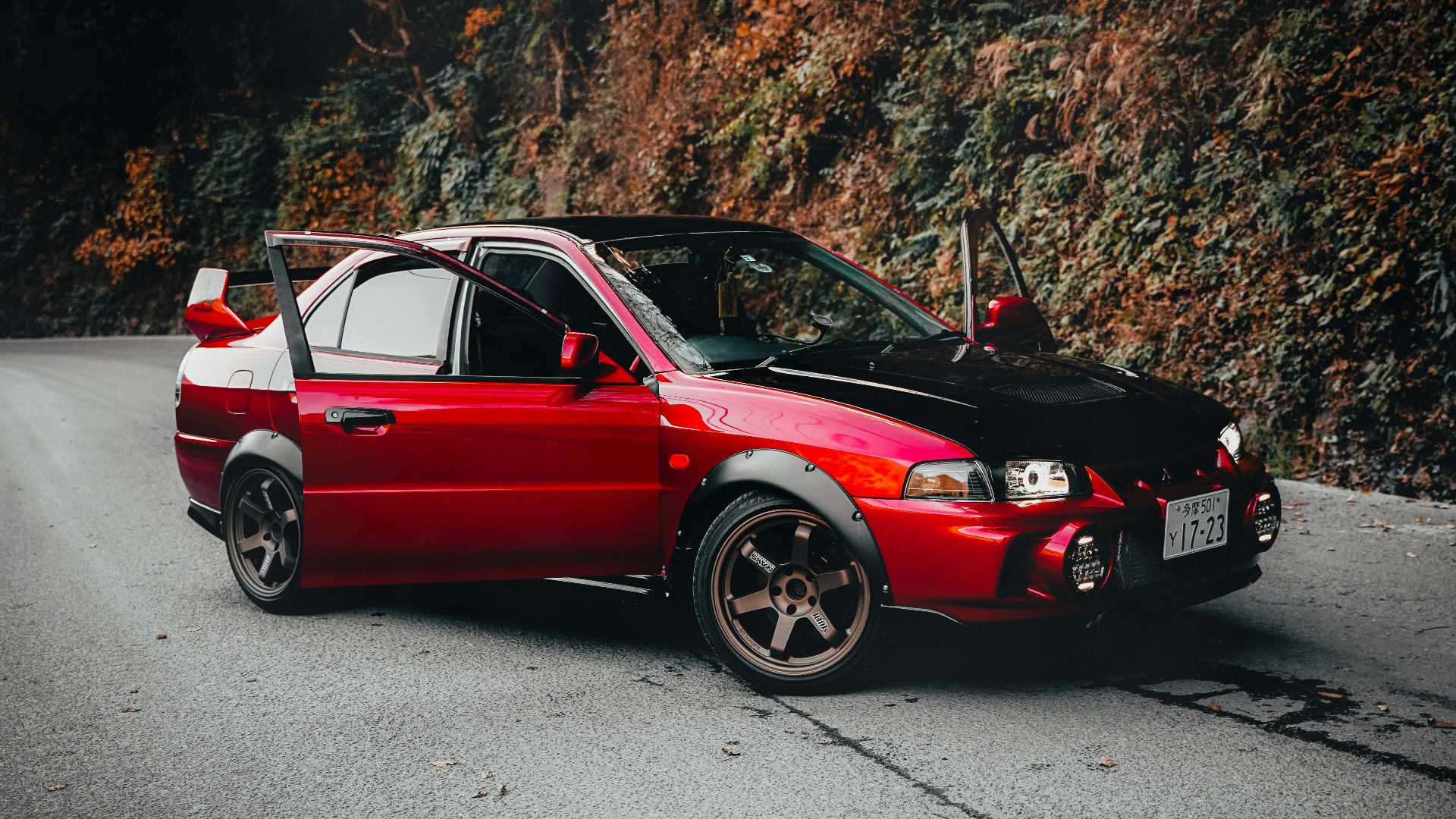 red bmw m 3 coupe on road during daytime