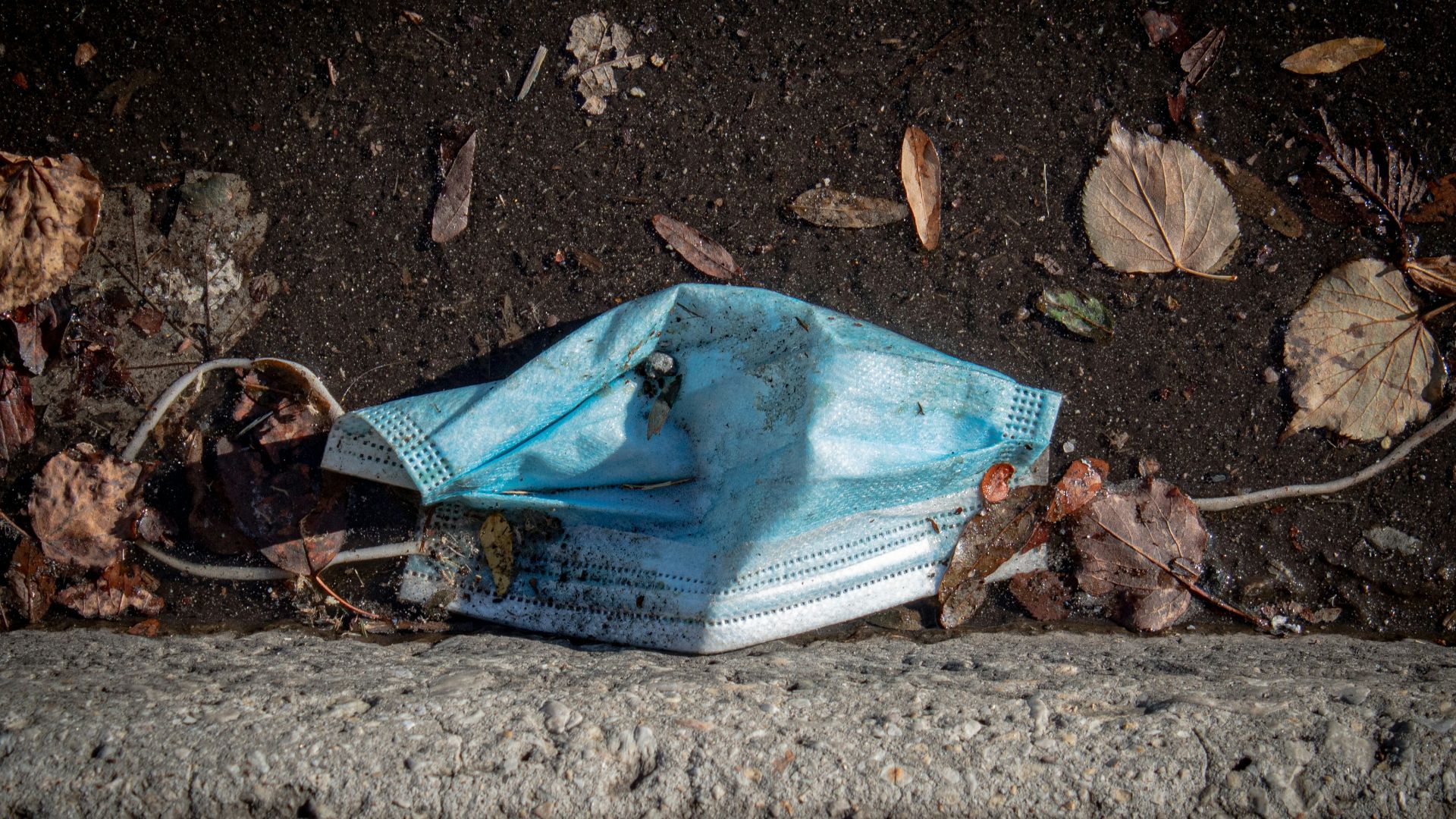 blue and white textile on gray concrete floor