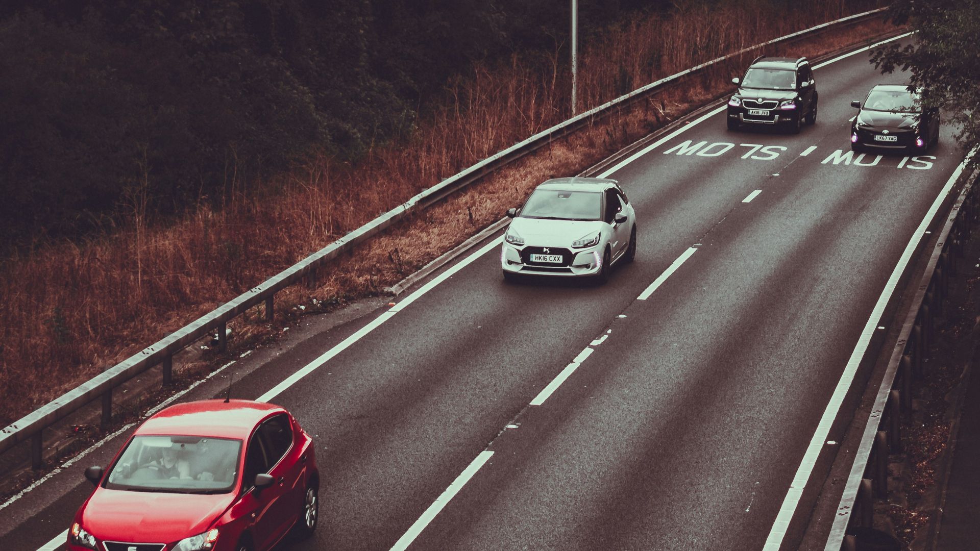 four vehicles in highway