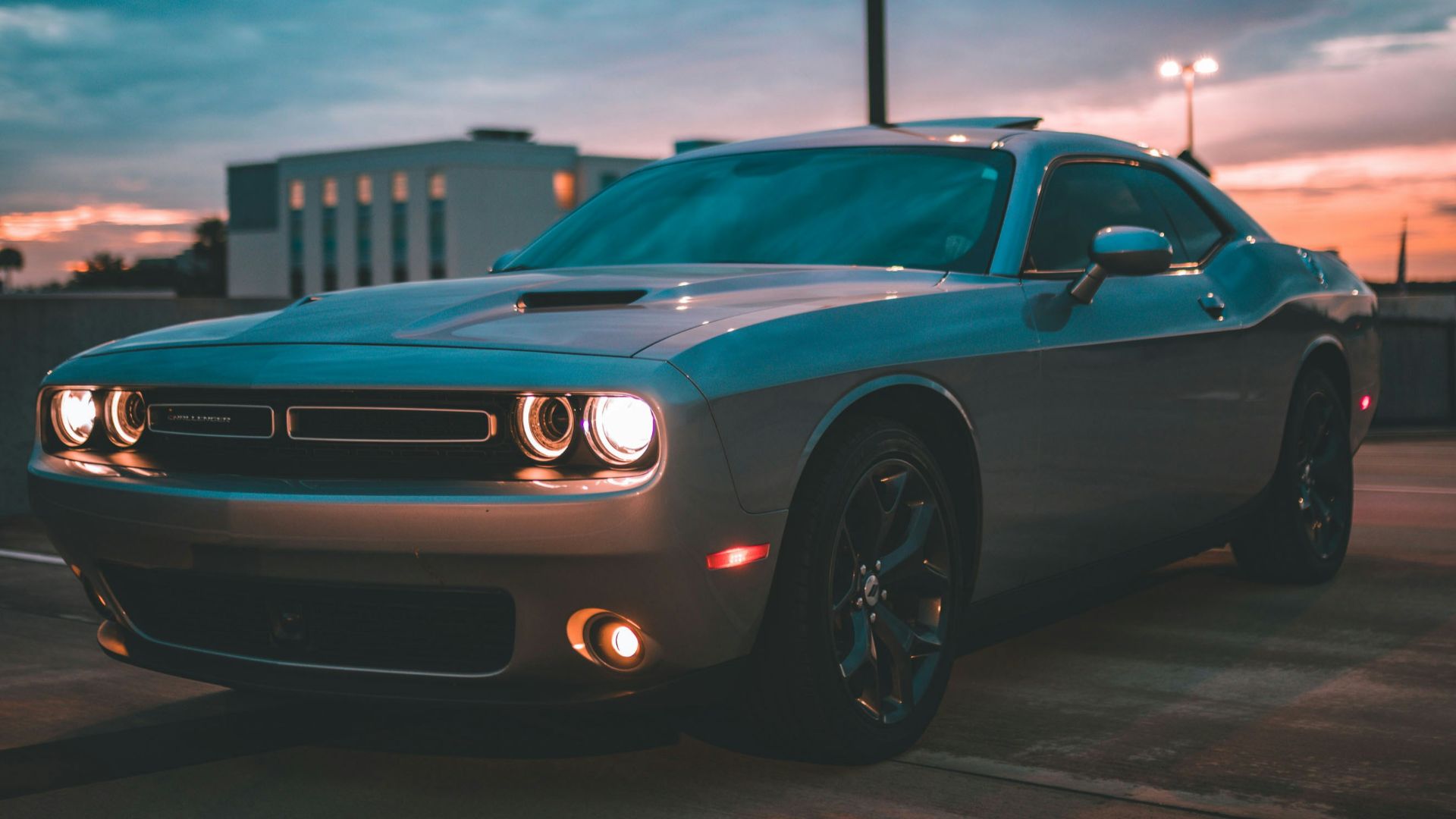 blue chevrolet camaro on road during daytime