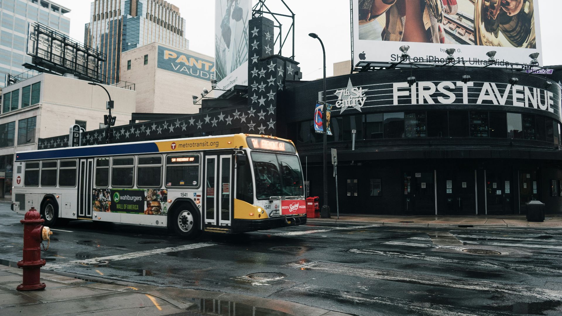 yellow and red bus on road during daytime