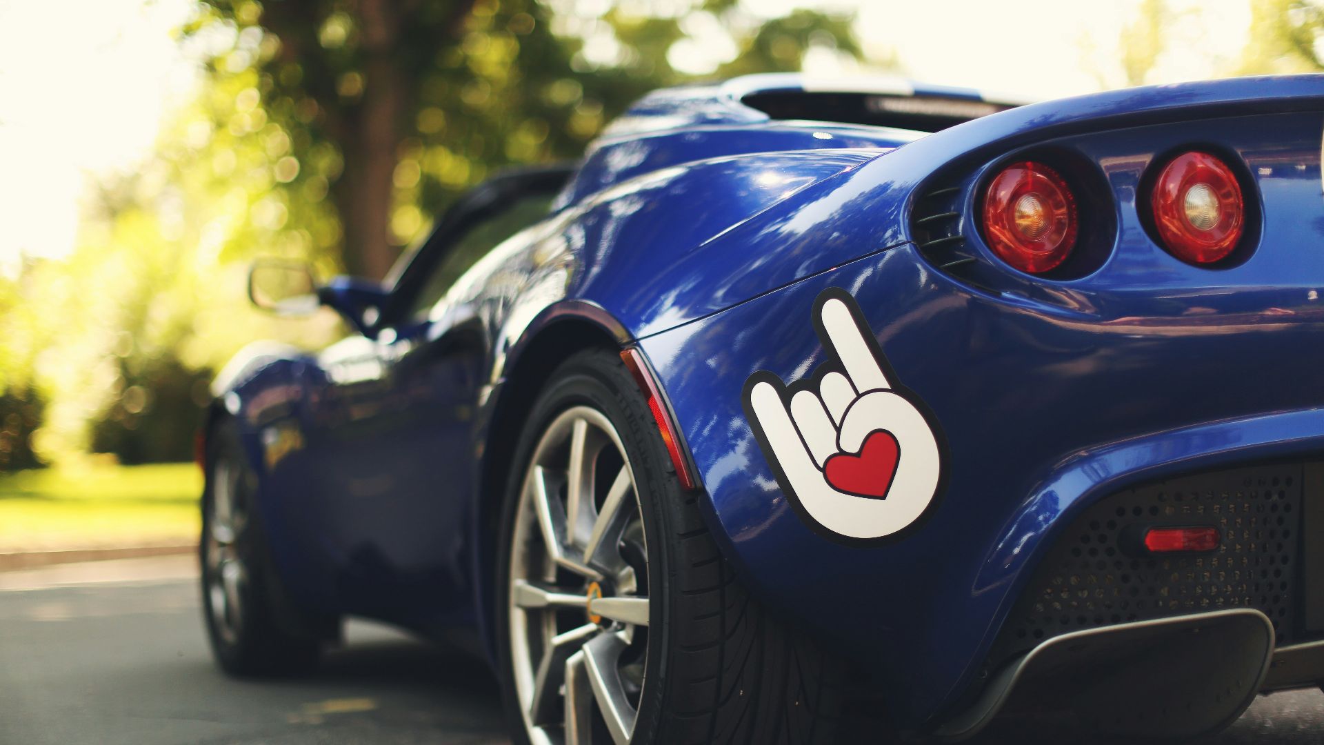 blue car parked on road
