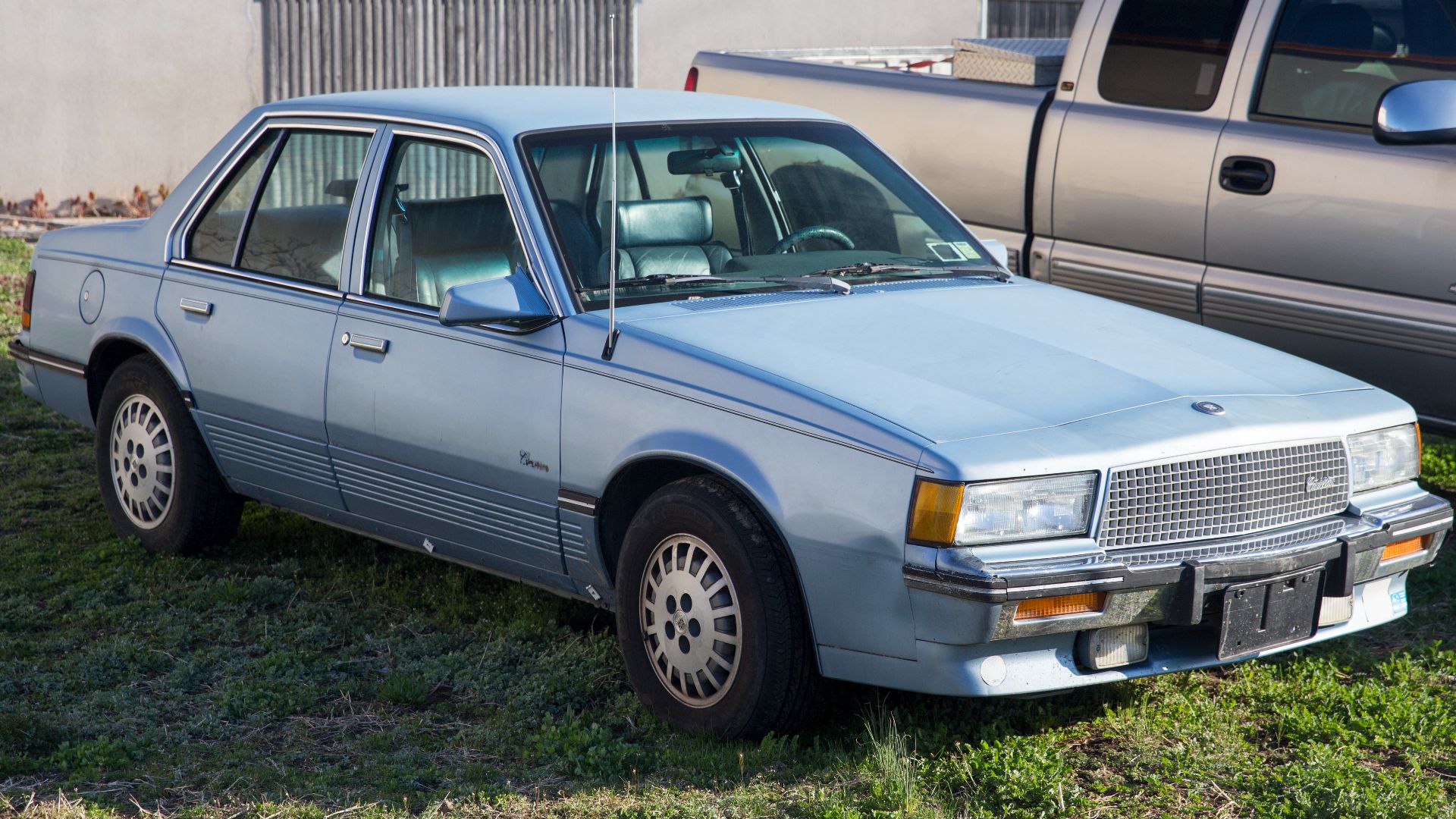 File:1988 Cadillac Cimarron in Bluish Silver, front right.jpg