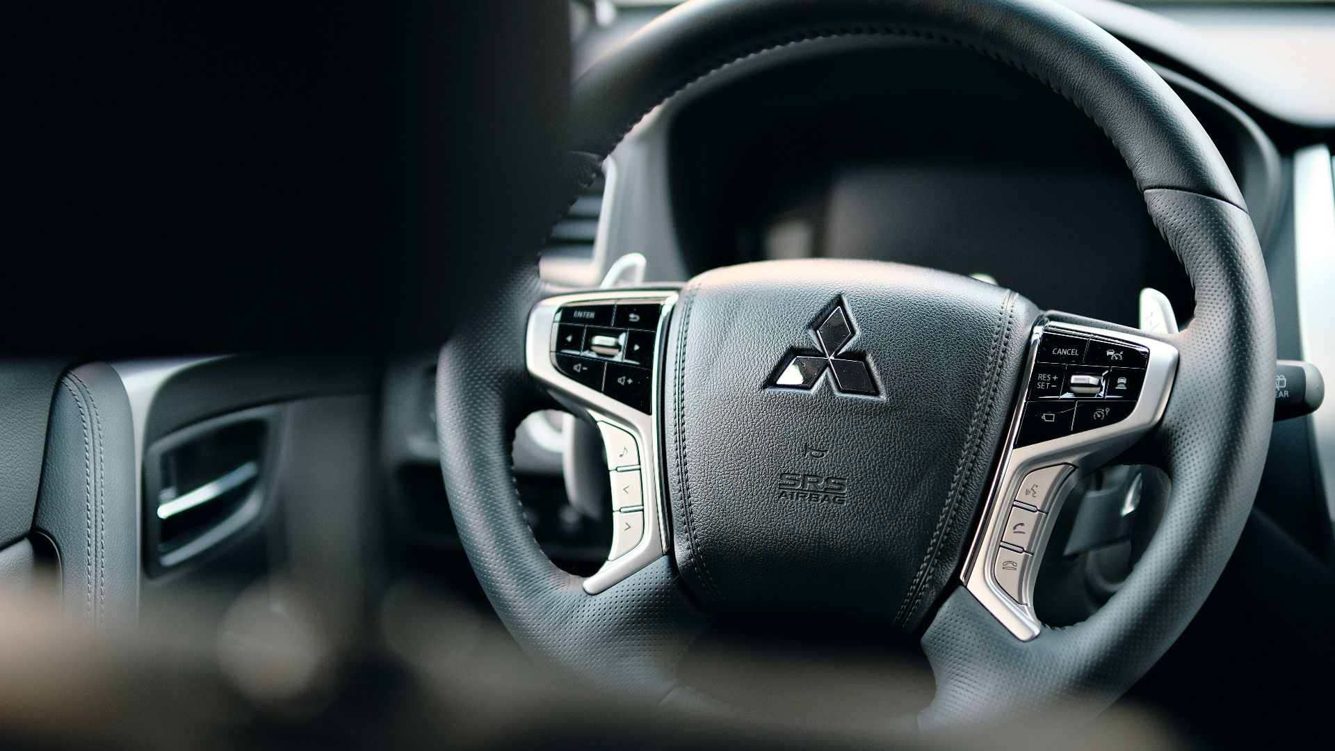 black honda steering wheel in close up photography